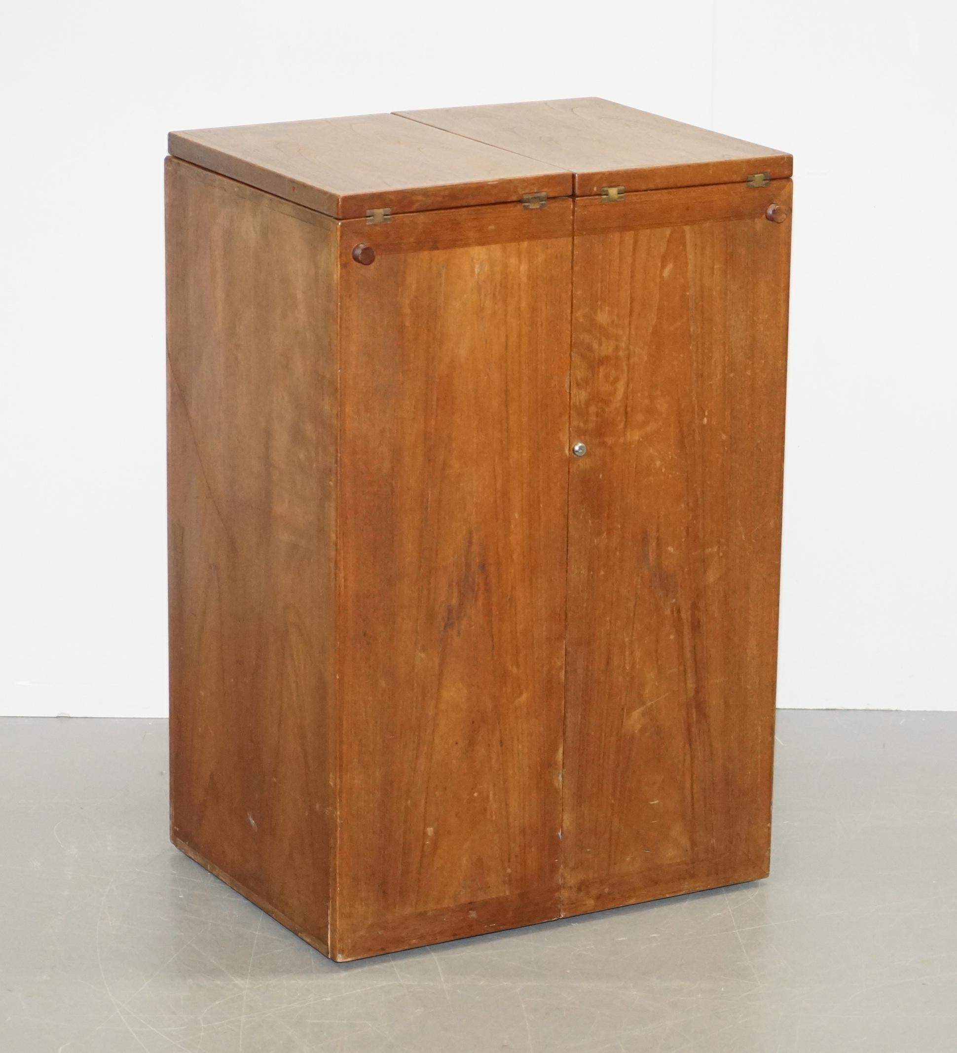 We are delighted to offer this lovely original circa 1960s solid Danish teak at home bar on wheels designed by the great Reno Wahl Iversen and retailed through Dyrlund

An absolutely amazing vintage Danish drinks bar in teak, this was designed by