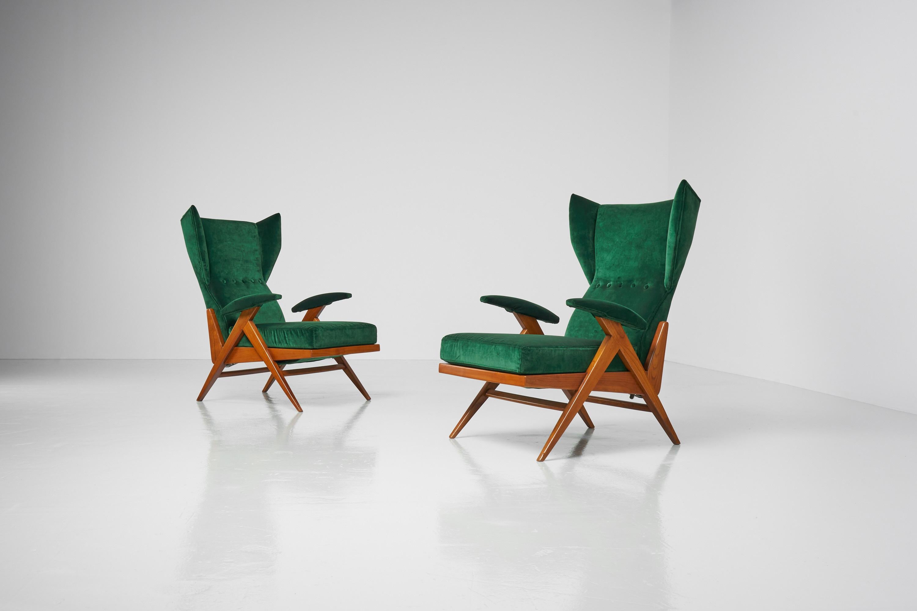 Stunning shaped pair of 'Camea' adjustable lounge chairs designed by Renzo Franchi and manufactured by Camea, Italy 1955. These dynamic shaped chairs have a solid cherry wooden structure, and they are recently reupholstered in a green Gucci velvet