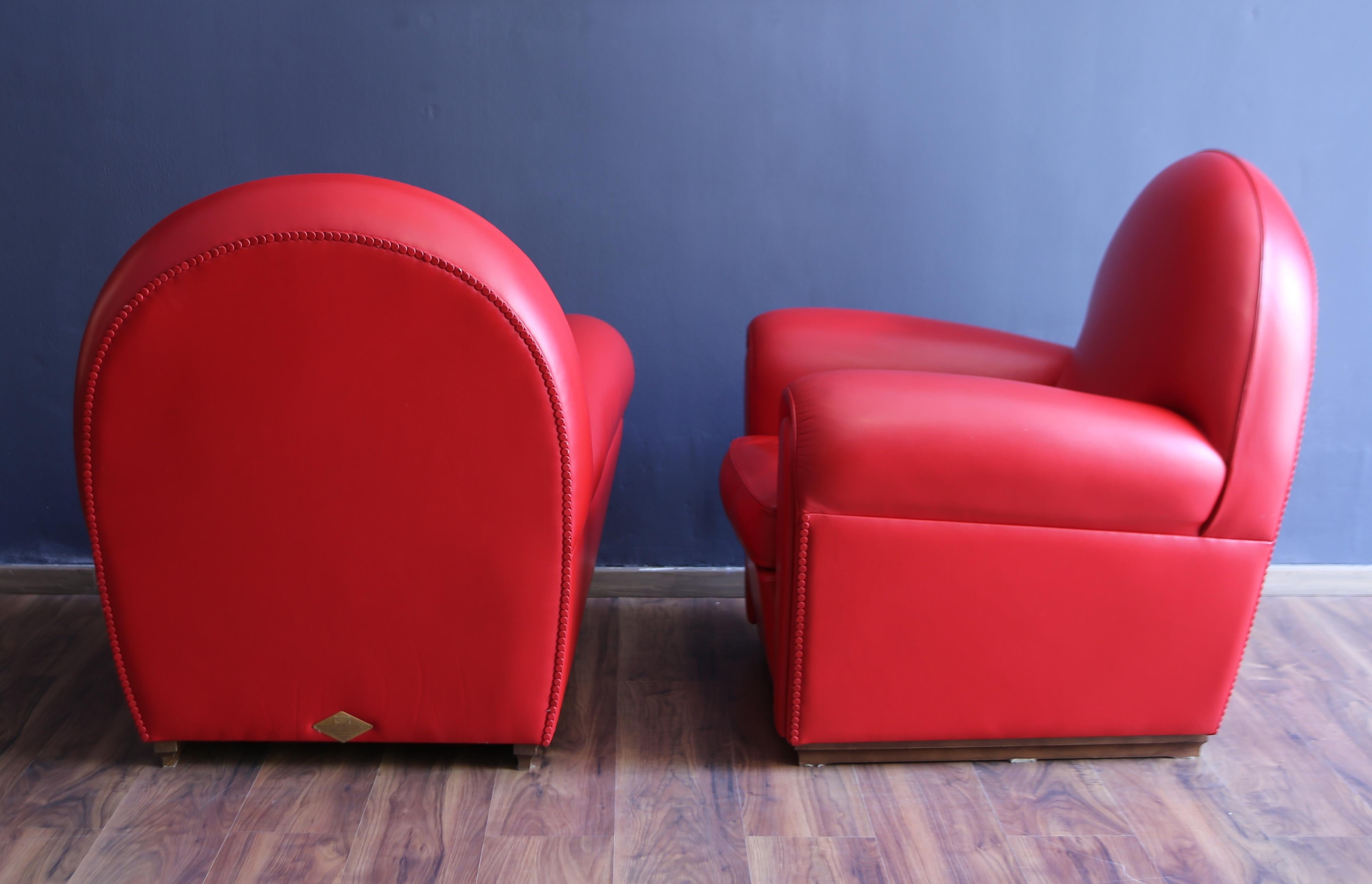 Italian Pair of Frau armchairs, model 904 “Vanity Fair” in red leather, 1980s in vendita