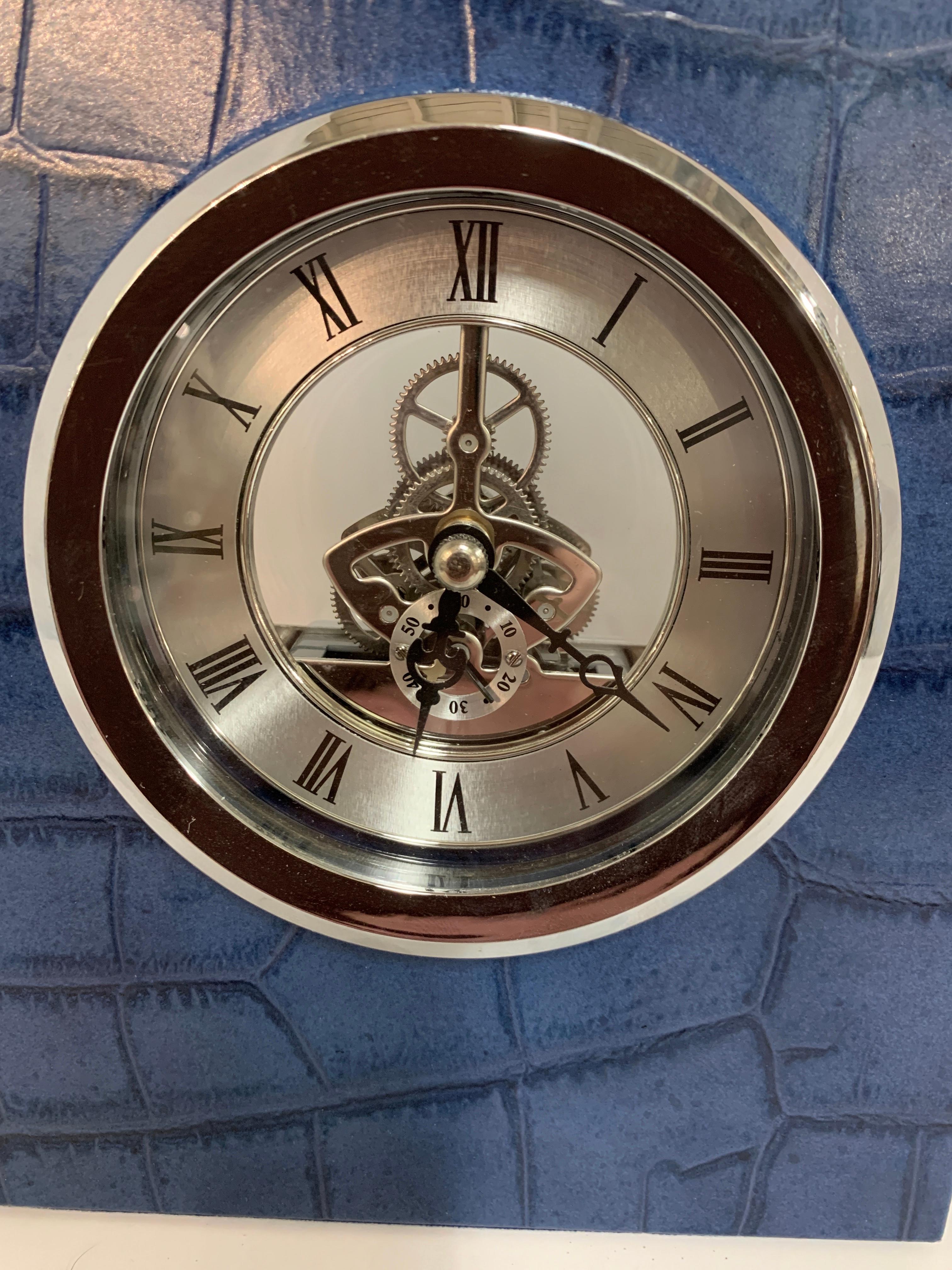 A simply beautiful clock in an alligator or crocodile grained leather by Renzo Romagnoli, the designer and purveyor of luxury games, chess and backgammon sets, jewelry boxes, watch winders and other items. This clock is in running condition with a