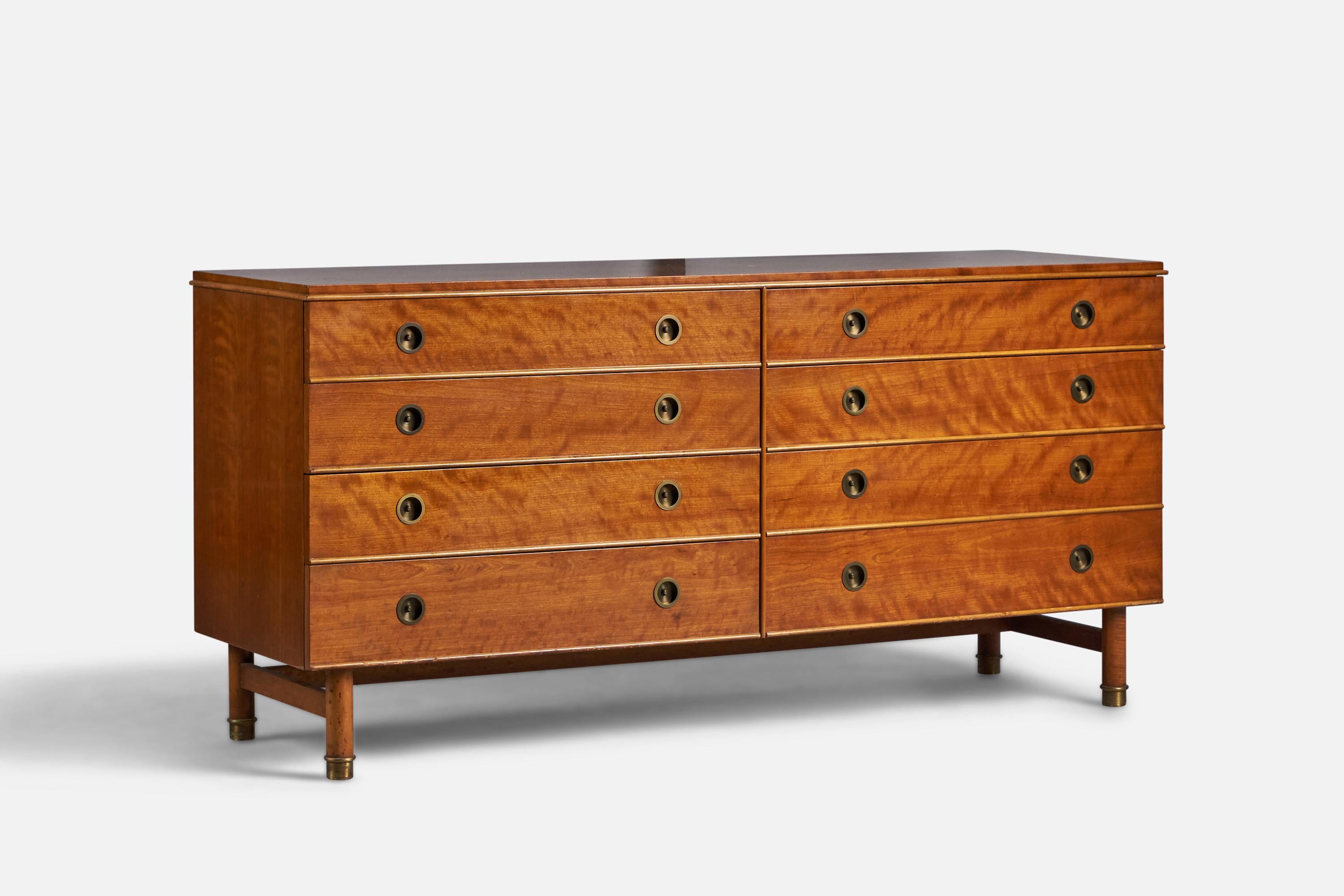 A mahogany, brass and maple dresser produced by Johnson Furniture Company USA, c. 1950s. Design attributed to Renzo Rutili.