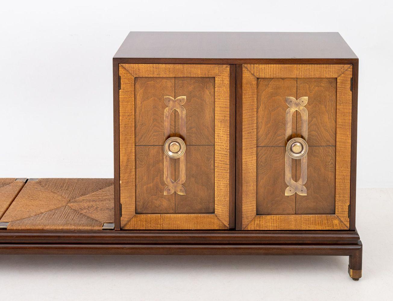 Renzo Rutili for Johnson Renzo Rutili for Johnson Furniture Mahogany Cabinet and Bench, the cabinet with two doors opening to two shelves, and the long bench with two rush seats, all on a fitted rectangular base atop four brass mounted legs. 31