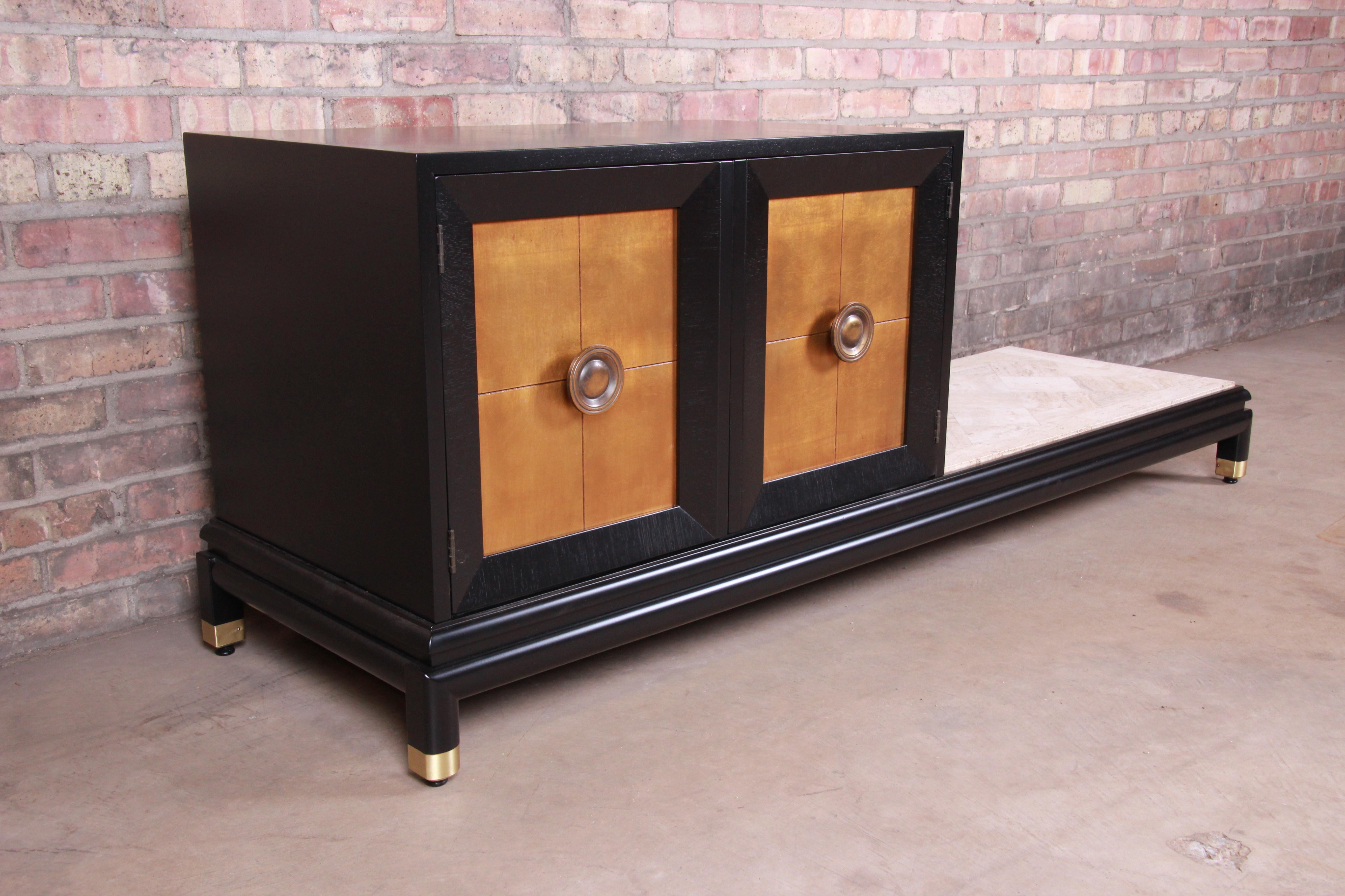 An exceptional Mid-Century Modern Hollywood Regency chinoiserie asymmetrical cabinet with bench

By Renzo Rutili for Johnson Furniture

USA, 1950s

Ebonized wood platform and cabinet with gold gilt doors. Original brass hardware and
