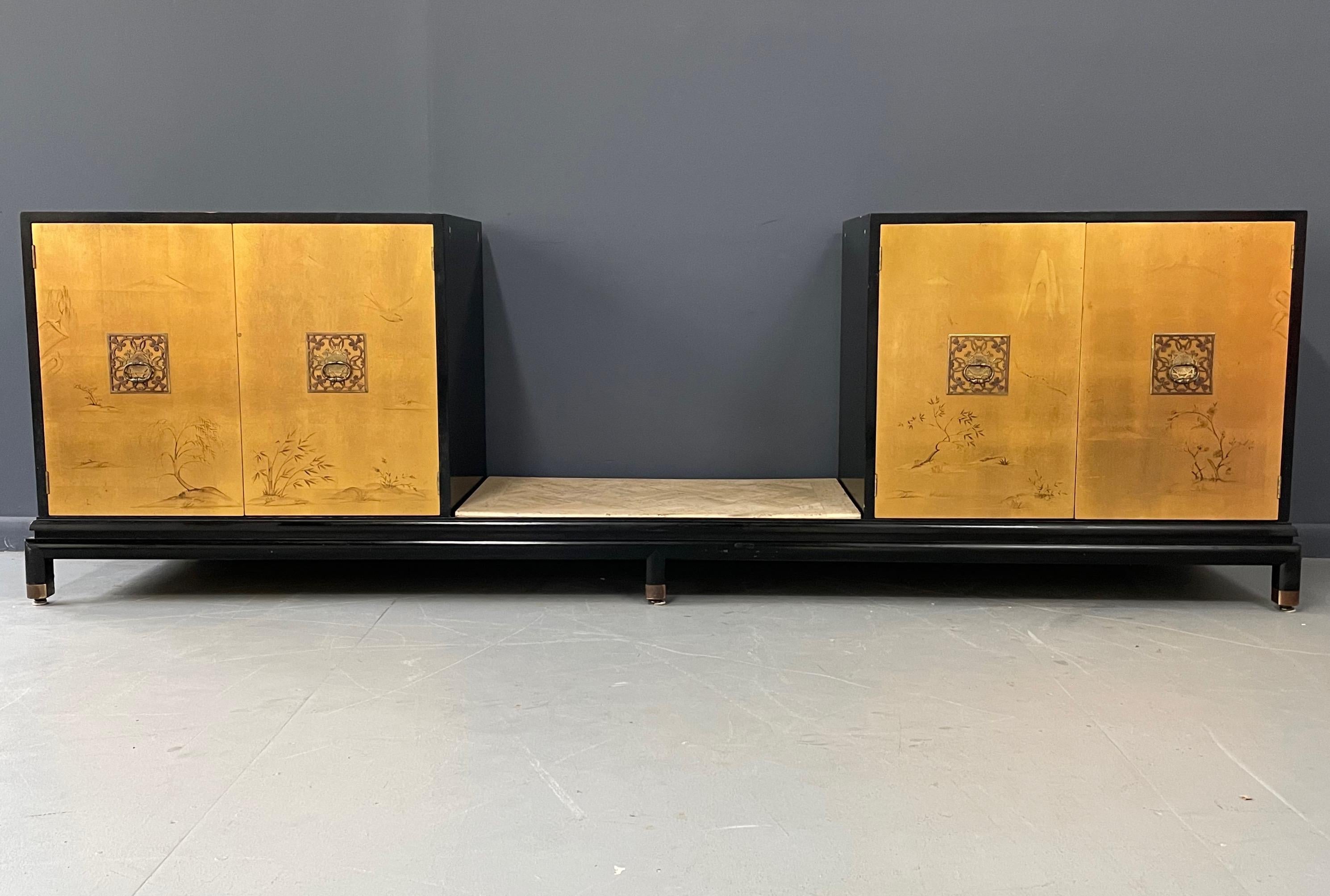 Lovely Renzo Rutili credenza with an Asian themed gold leaf cabinets with two shelves in each and a finished back with a pagoda design and a travertine shelf.