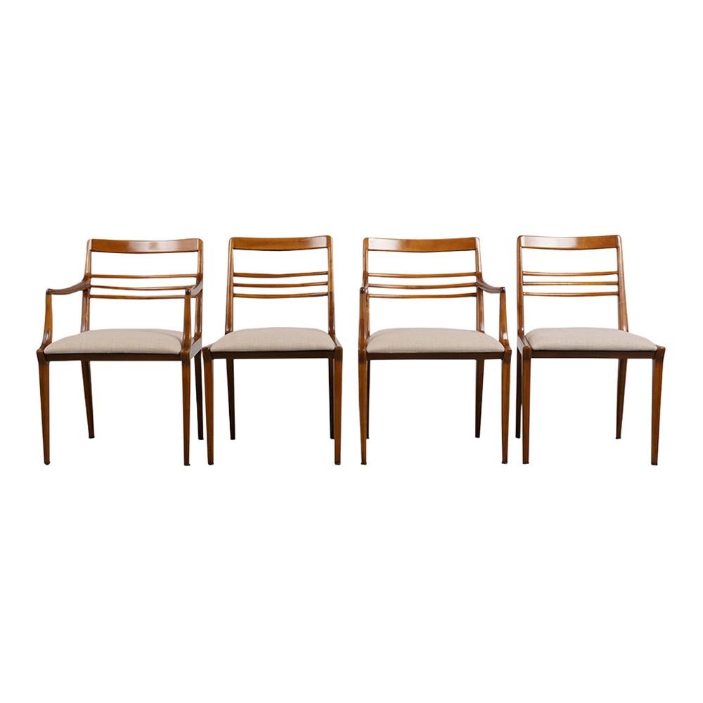 Step into the world of mid-century elegance with our beautifully restored five-piece dining chair set designed by the iconic Renzo Rutili for Johnson Furniture. Each chair in this exquisite collection is a masterpiece of design and craftsmanship,