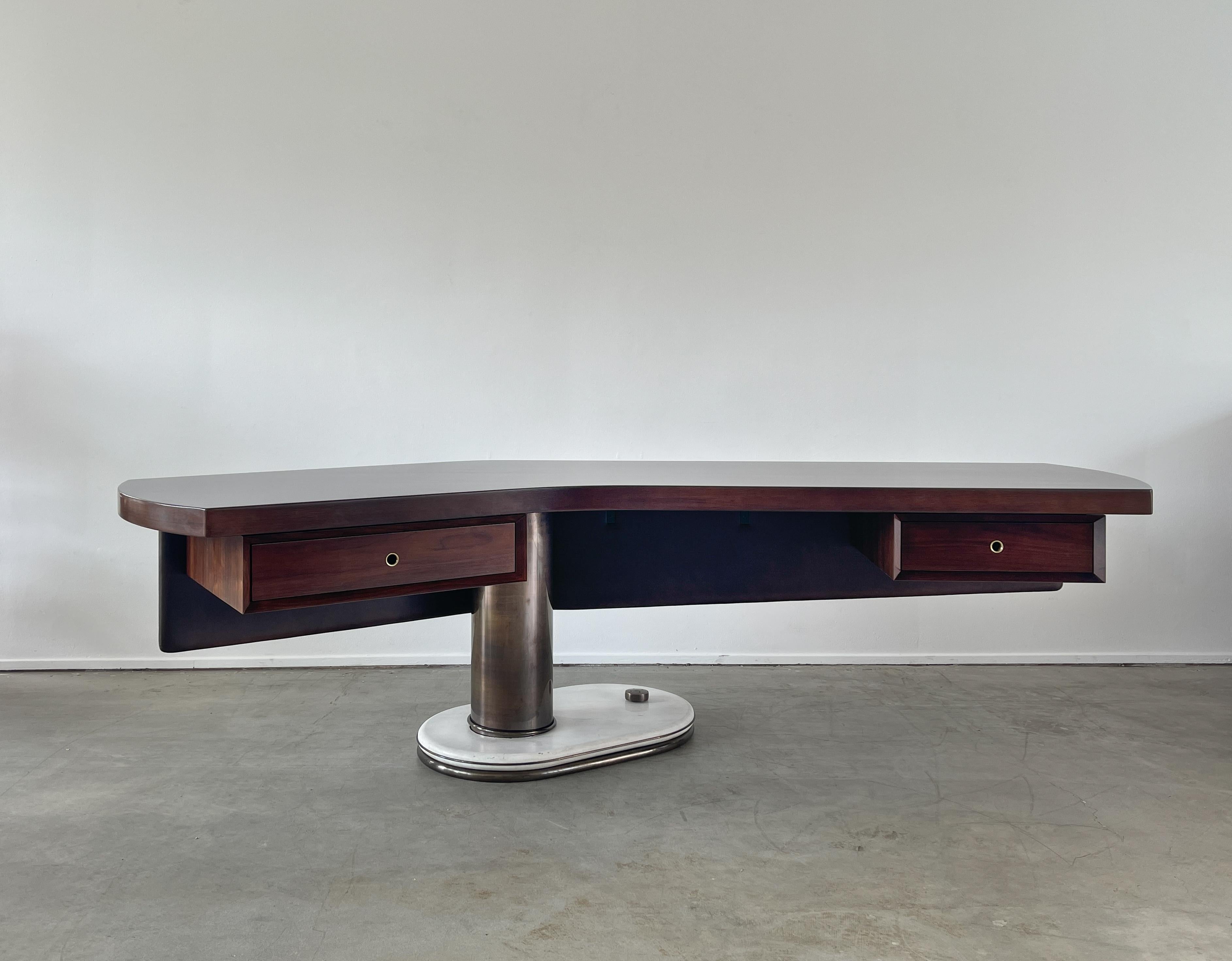 An incredible Italian desk by artist Renzo Schirolli - 
Boomerang shaped walnut top with floating leatherette covered modesty panel and pedestal drawers 
Cylindrical bronze column sits on solid marble base supporting cantilevered asymmetrical desk
