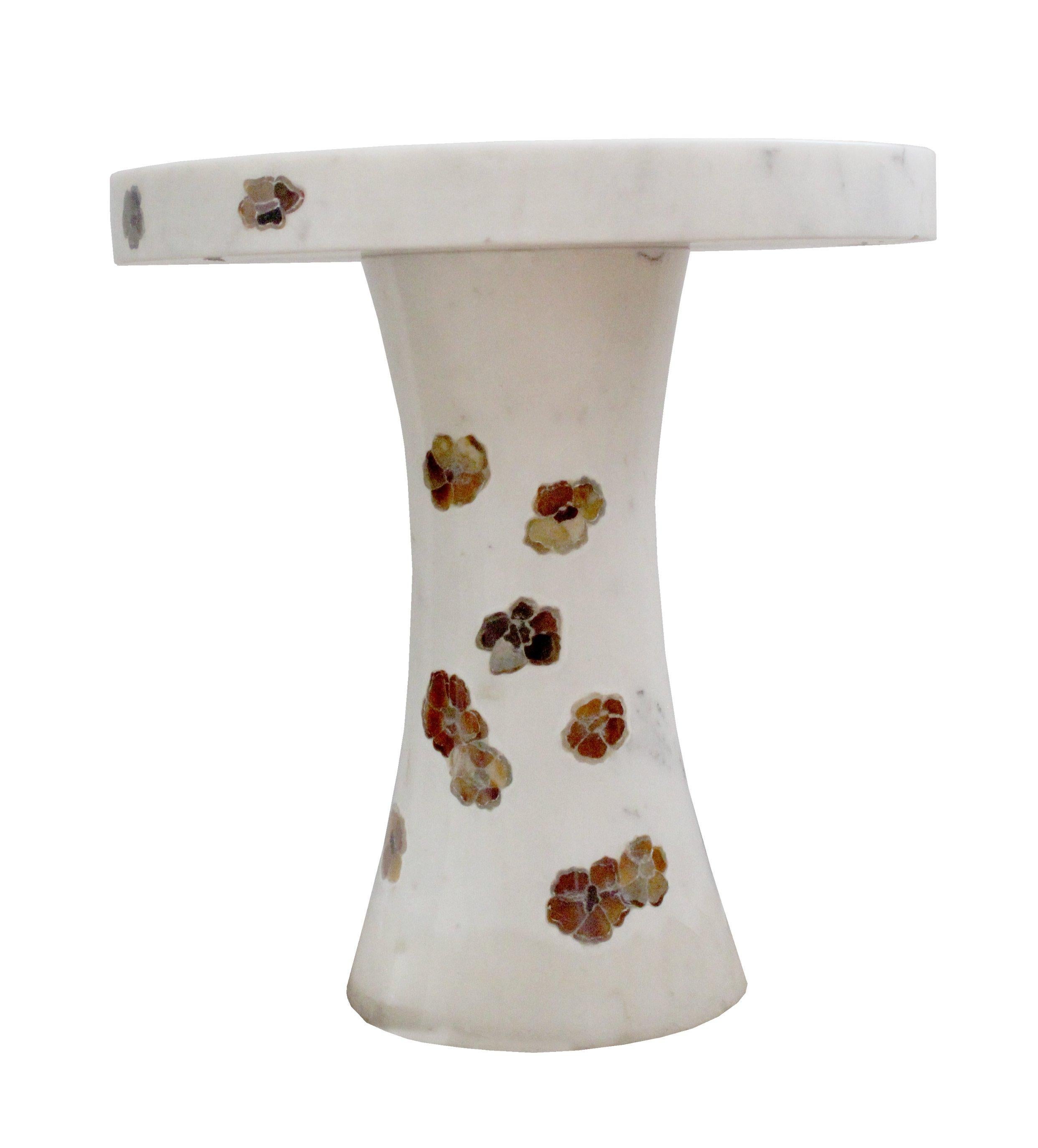 The Scattered Pansies table is a part of the Ornamenti collection. Delicately cut pieces of agate, tiger eyes, mother of pearl and other semi precious stones are carefully inlaid into the base stone by our master craftsmen. The collection features