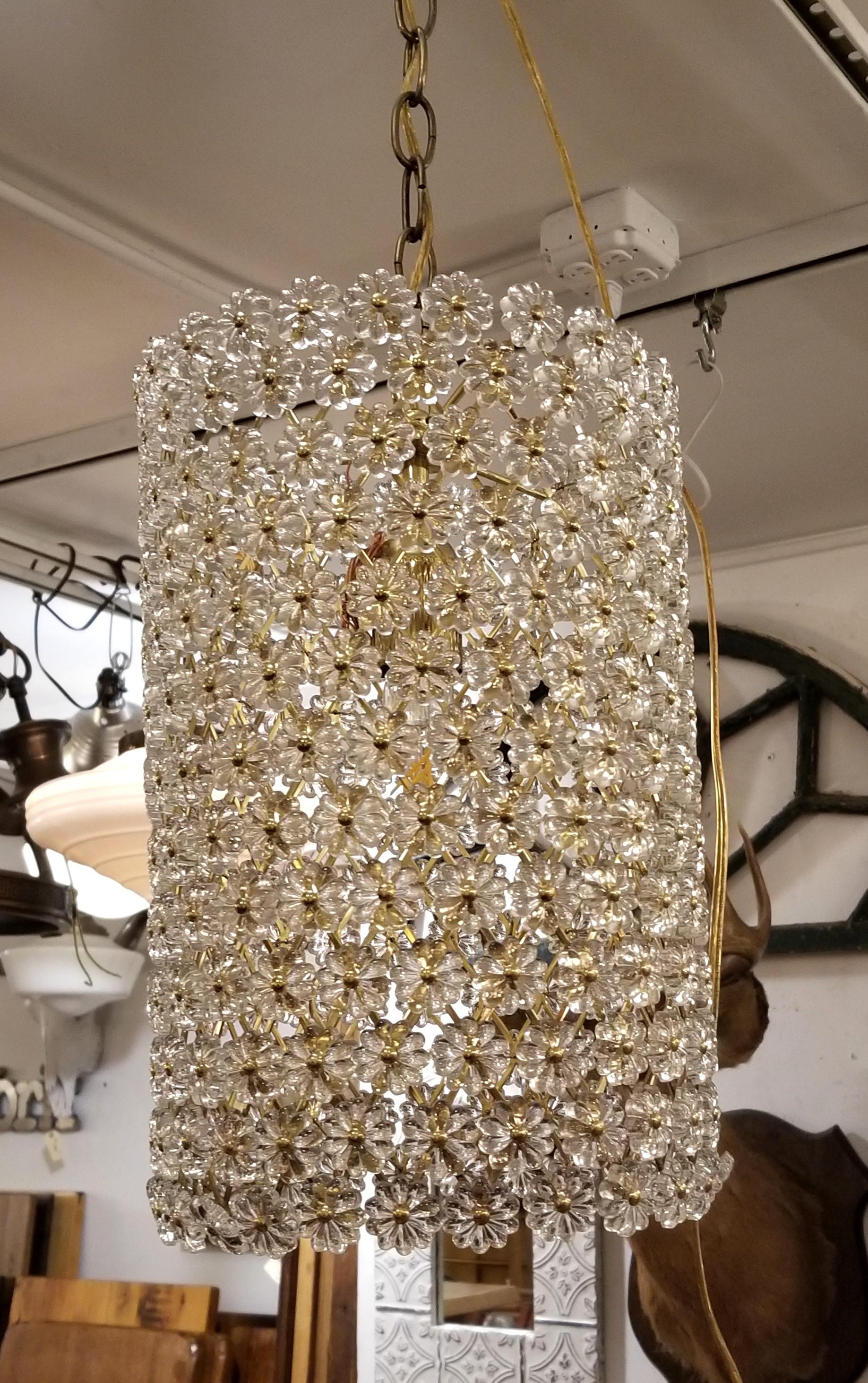 Modern replica Maison Baguès style floral pendant light with chain. Cylindrical brass frame with clear florets. The shade itself is 15 in. high without measuring any chain or canopy. This item can be seen at our 302 Bowery location in Manhattan.