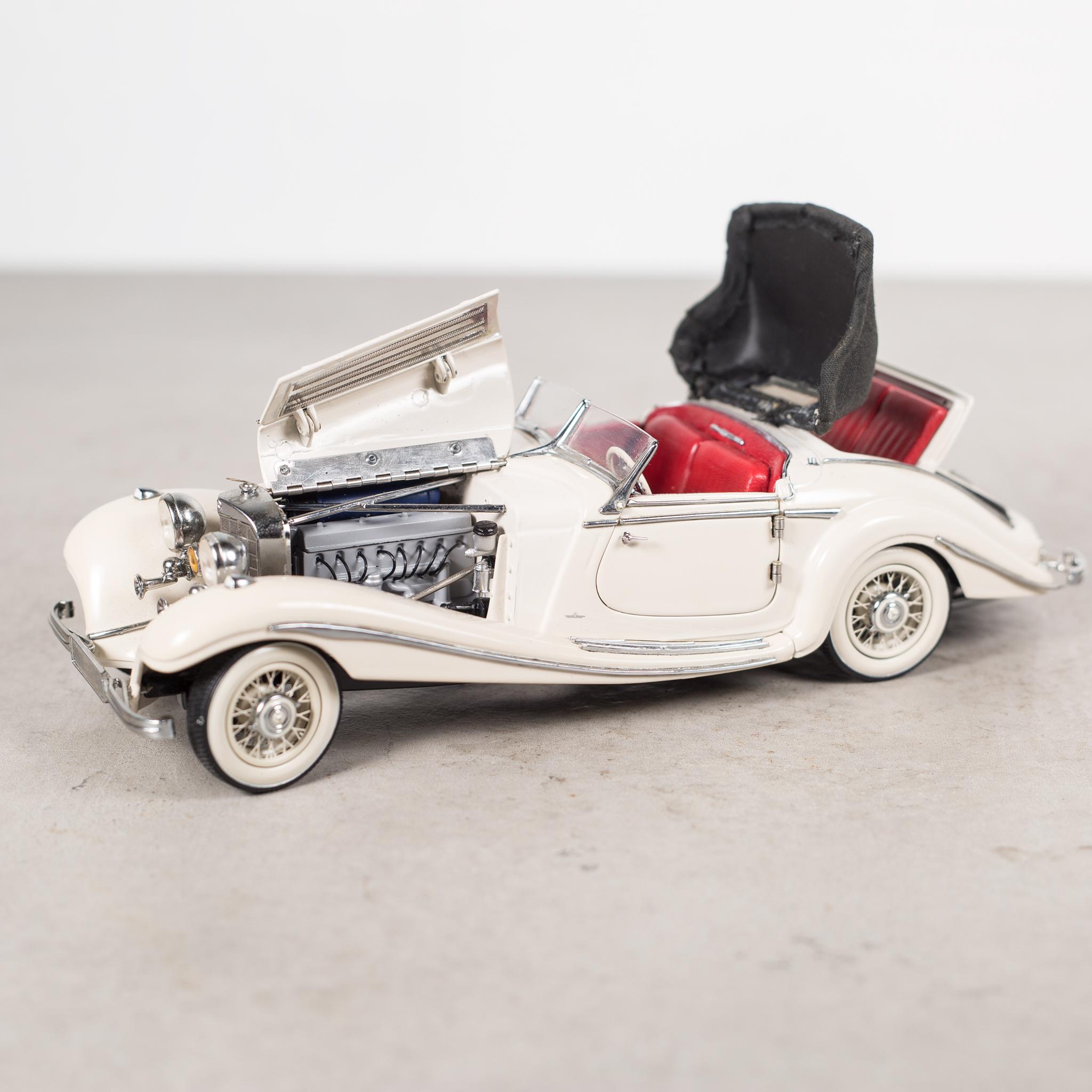 About

An exact replica of a 1930s Mercedes Benz 500 K Spezialroadster created by CMC of Germany. This diecast model is 1/24 scale with red leather interior, retractable roof, working hoods, doors and rumble seat. The rubber wheels turn with the