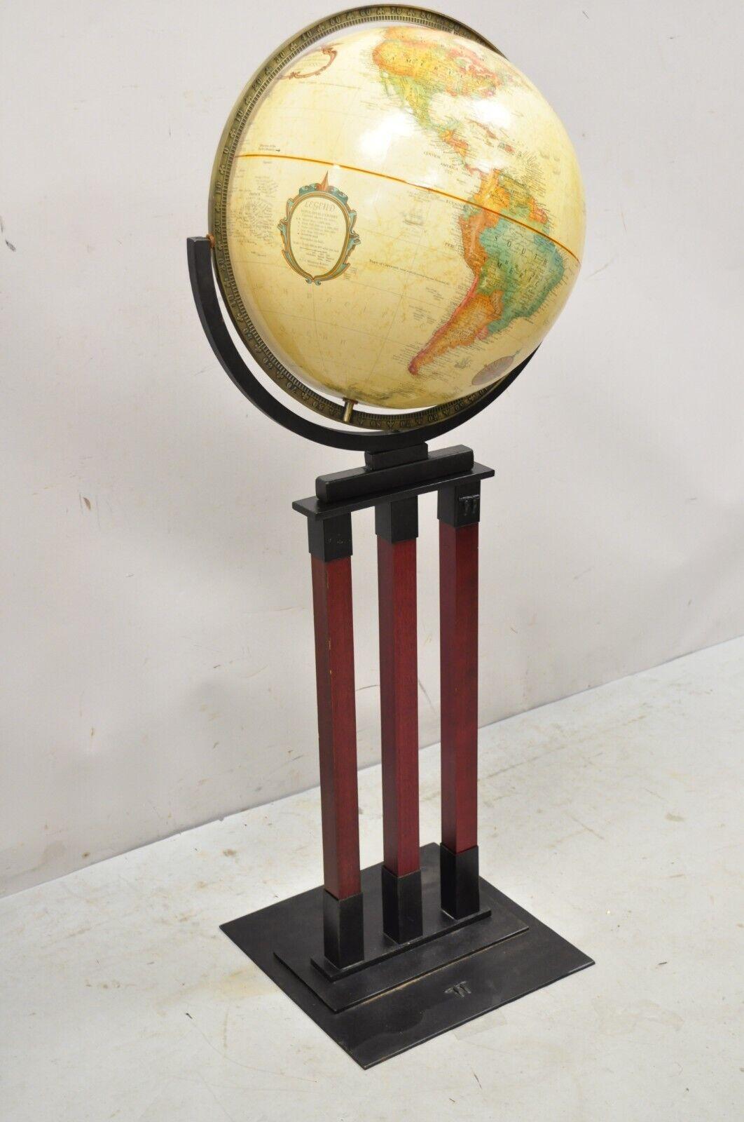Replogle 16 inch diameter globe on stand world classic series standing. Item features a heavy iron base and frame, wooden accents, fiberglass globe, very nice item, great style and form. Circa Late 20th Century.
Measurements: 
Overall: 47