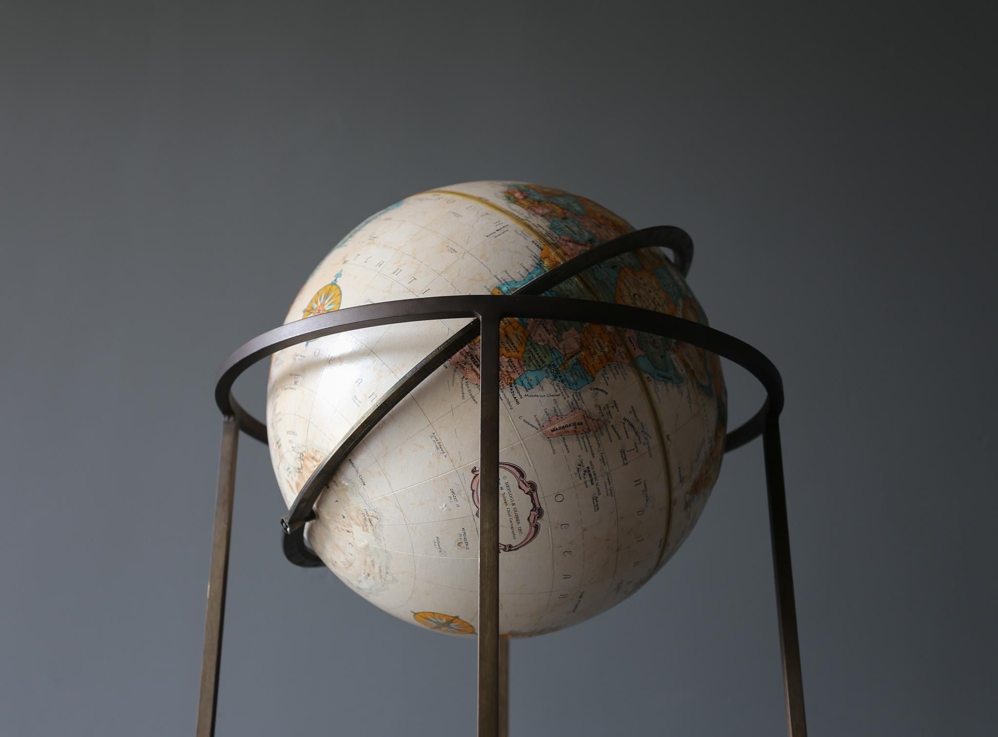 Replogle globe on a brass stand in the manner of Paul McCobb circa 1955.