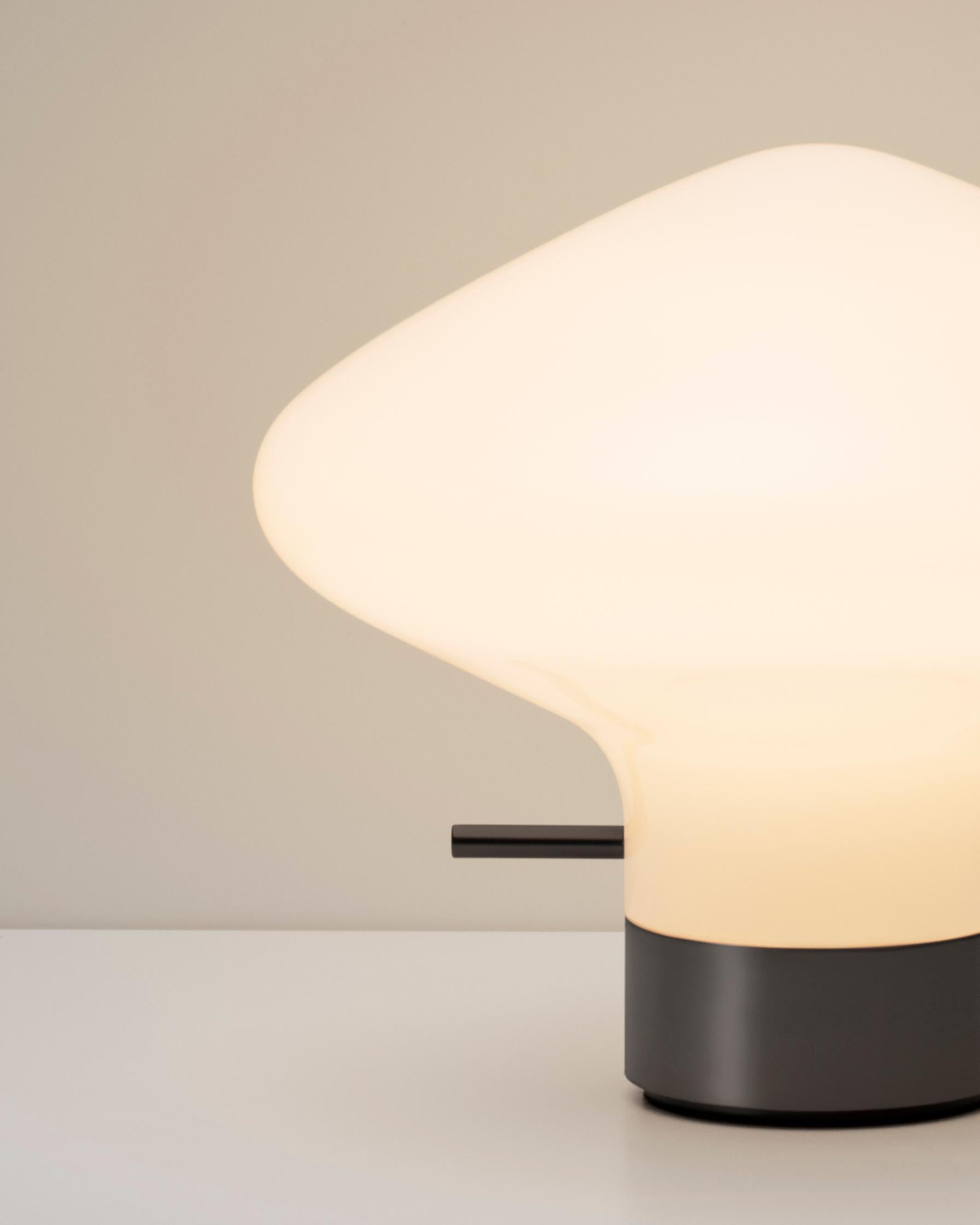 Repose table lamp by GamFratesi for LYFA

Size : H 14.5 cm D 17.5 cm
Materials : Opal glass, brass

Textile wire (black or white) 250cm
Light source: G9 max 60 W (110V-230V)

--
GamFratesi has designed the Repose series with simplicity in