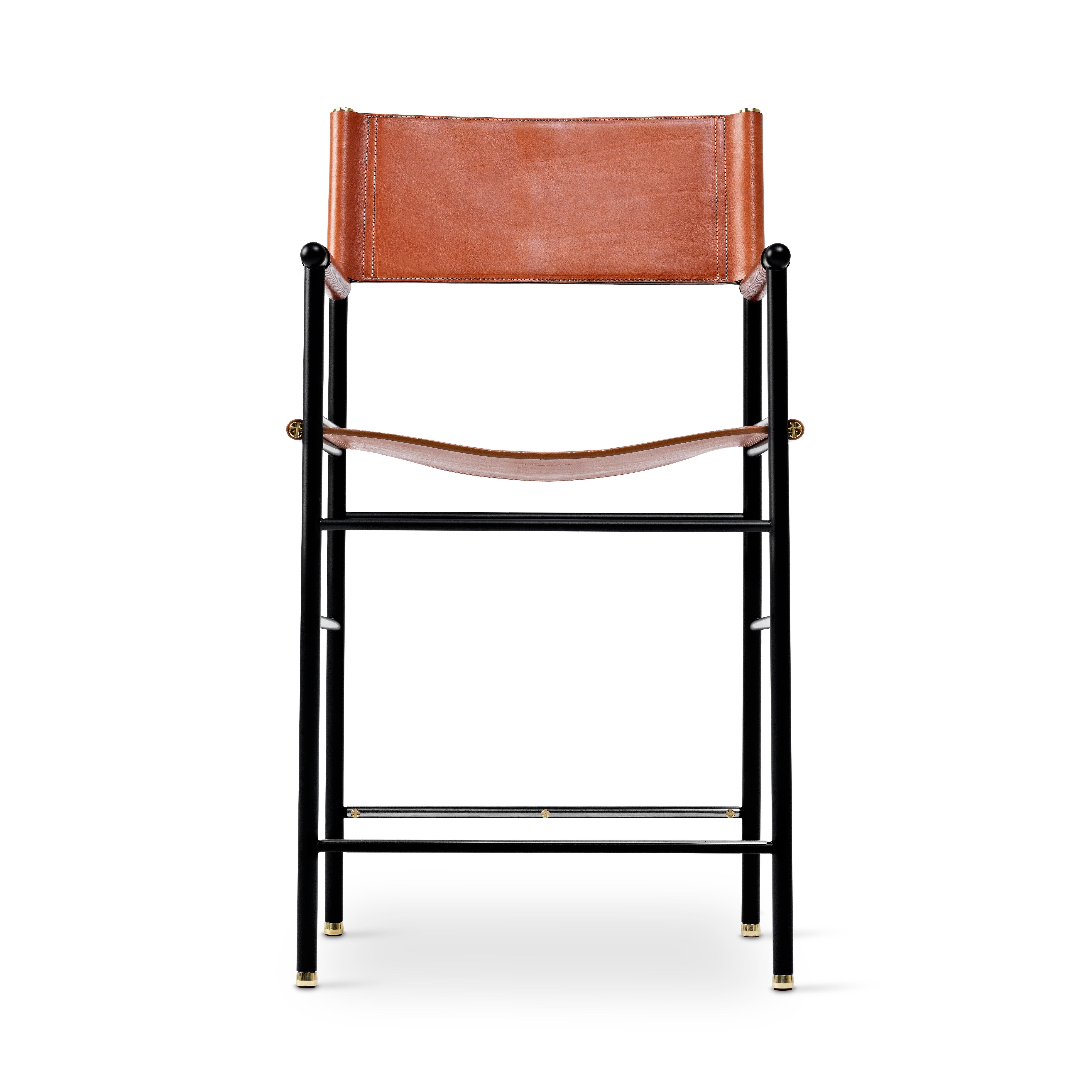 The “Repose” contemporary counter height stool belongs to a collection that revisit the director chair collection, serene pieces where exclusivity and precision are shown in small details such as the hand-turned metal nuts and bolts that fix the