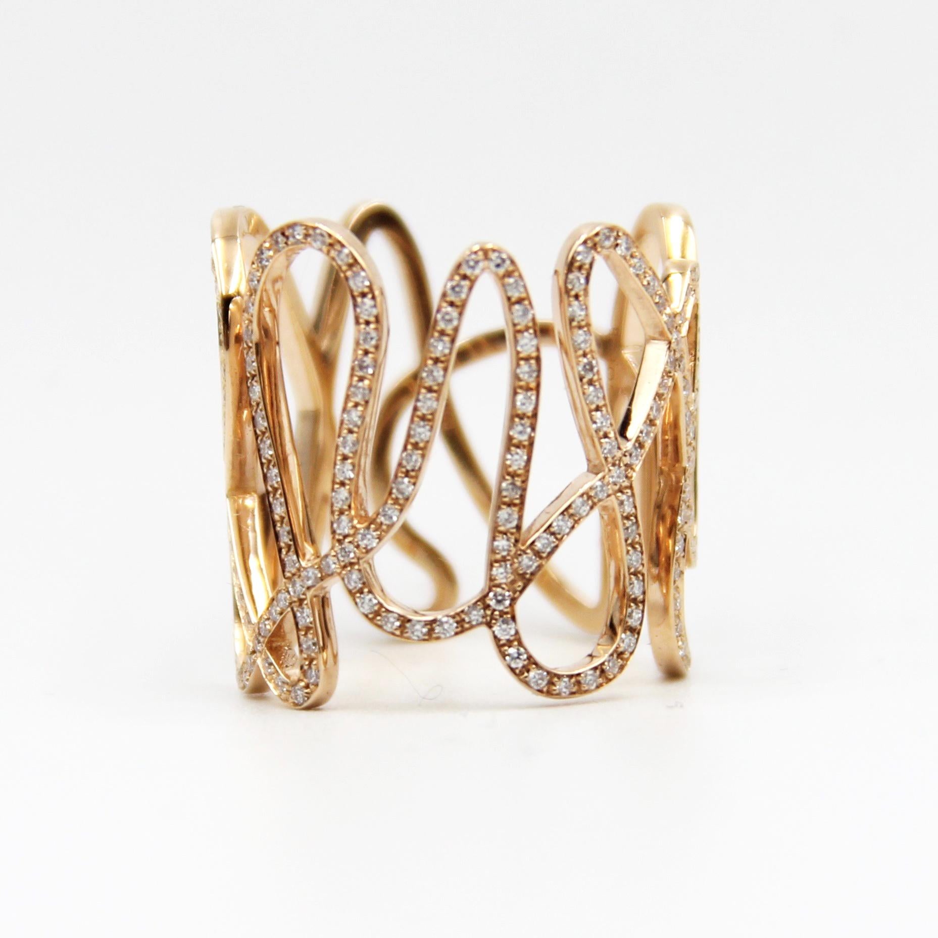 Repossi's perfect 18k pink gold woven ring with brilliant cut diamonds. Marked 2829AL , 750 and C14-1054 serial number inside . 