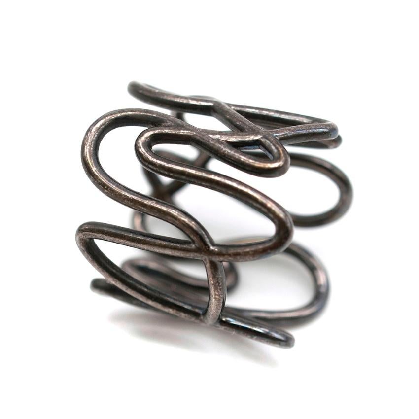 Repossi Black Gold White Noise Ring

Repossi's intricately woven ring is designed to resemble a spectral register of white noise.

Please note, these items are pre-owned and may show signs of being stored even when unworn and unused. This is