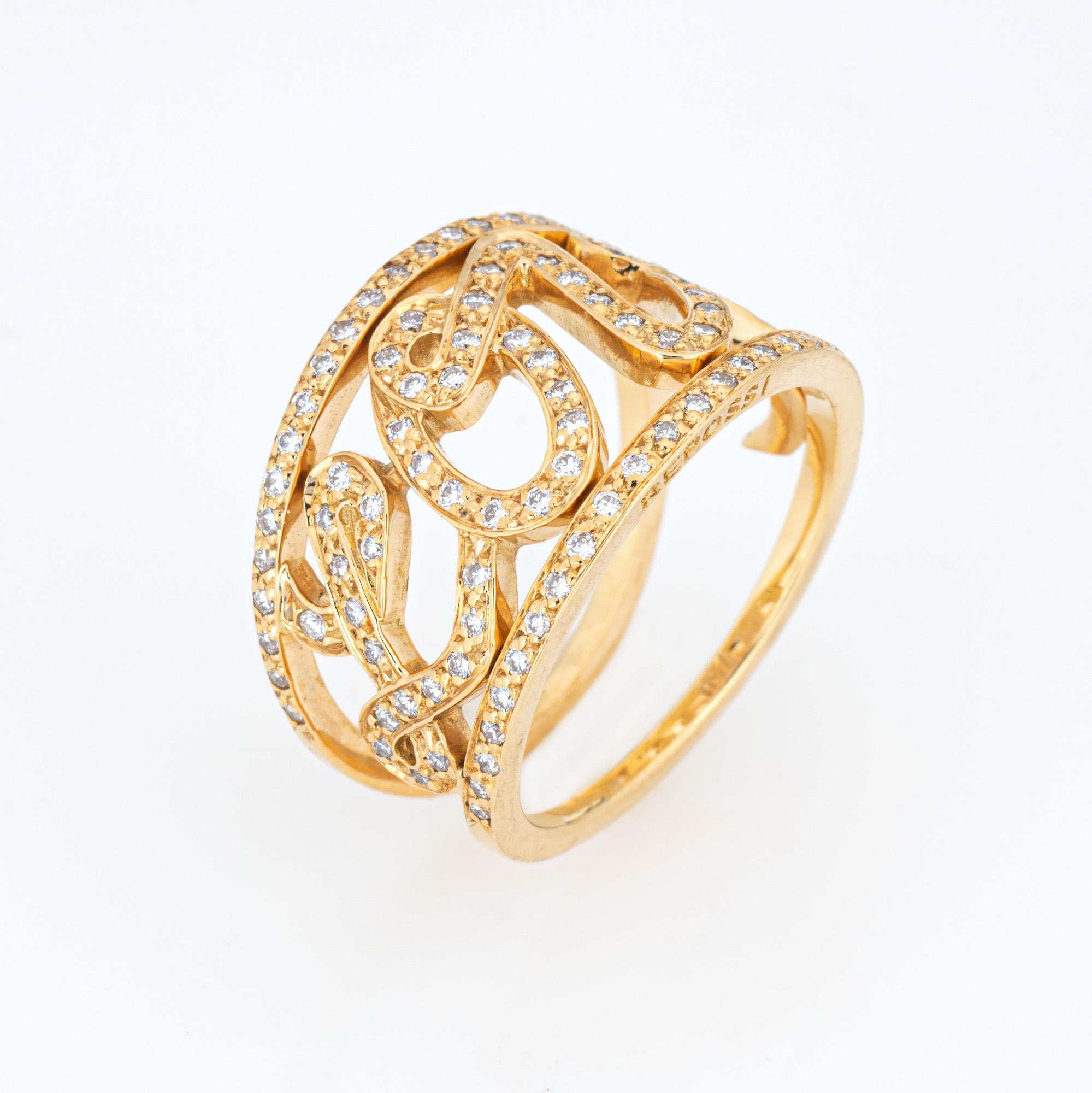 Pre-owned Repossi Diamond 'Love' cursive script ring crafted in 18 karat yellow gold.  

Round brilliant cut diamonds total an estimated 0.55 carats (estimated at G-H color and VS2-SI1 clarity). 
The simple and elegant 'Love' script split shank band