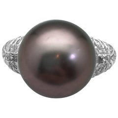Repossi Ring, Diamonds and a Tahitian Pearl. Repossi Ring, Diamonds and a Tahitian Pearl.