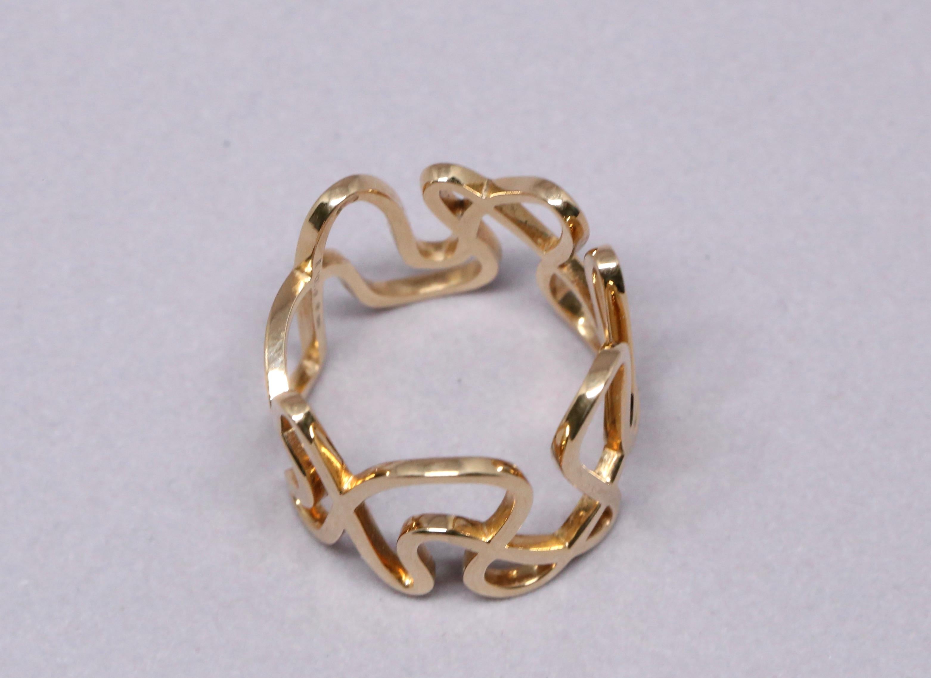 Very unusual, 18k gold 'white noise' ring by Repossi. Signed and numbered. Ring size is approximately a US 8 at the center of ring however this will fit a size 7 due to the extra very wide band. Band width is approximately 16mm. Made in France.