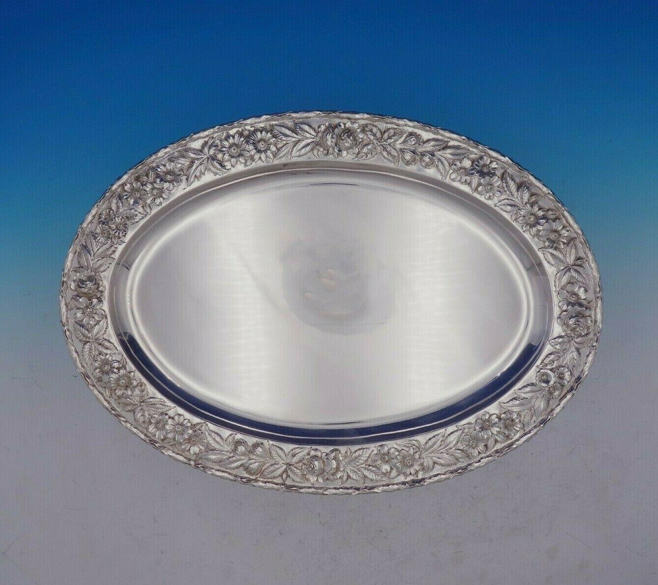 Repousse by Kirk

Lovely Repousse by Kirk sterling silver serving platter hand decorated with rose border marked #2518A. This platter measures 18