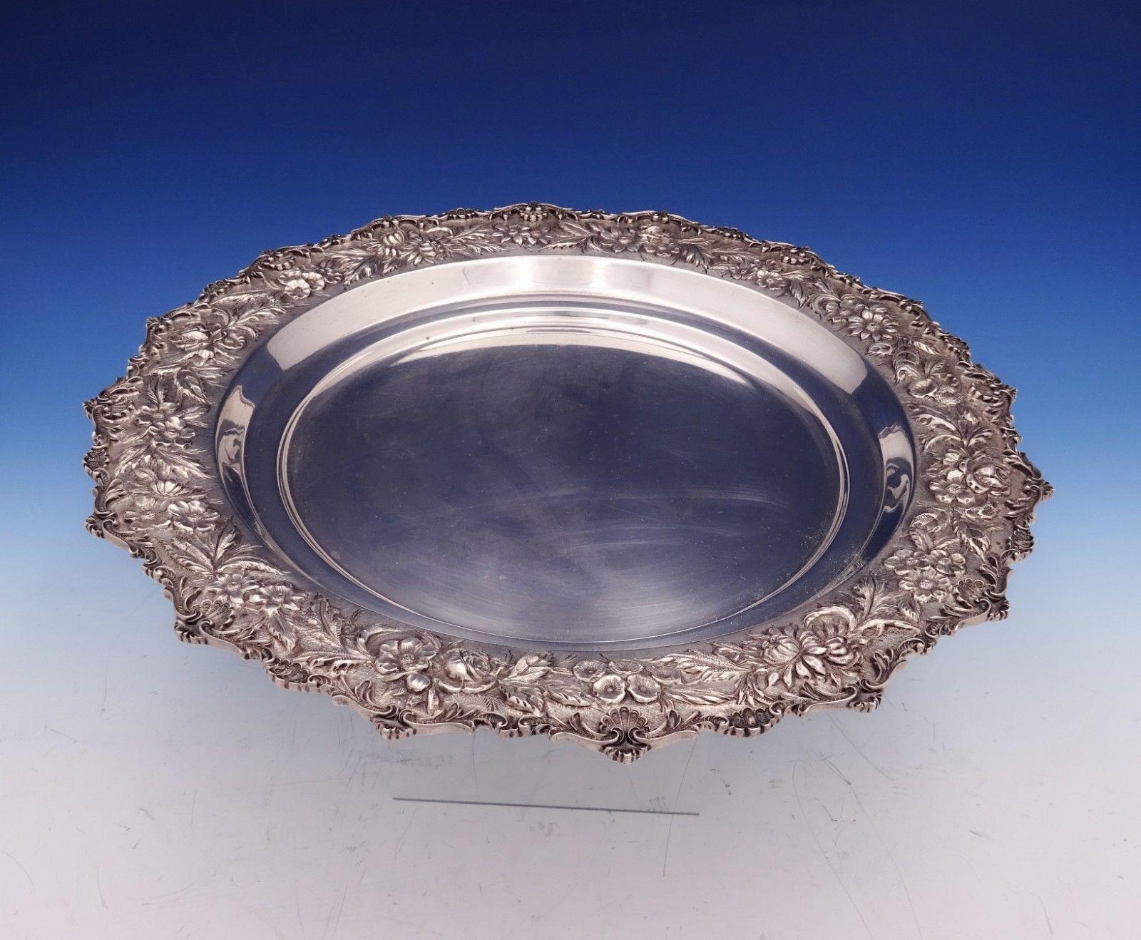Repousse by Kirk sterling silver round tray marked #2544 hand decorated. This piece measures 1 1/8 x 13 1/2 in diameter and weighs 33 troy ounces. It is not monogrammed and is in excellent condition. Pretty scalloped edge!
