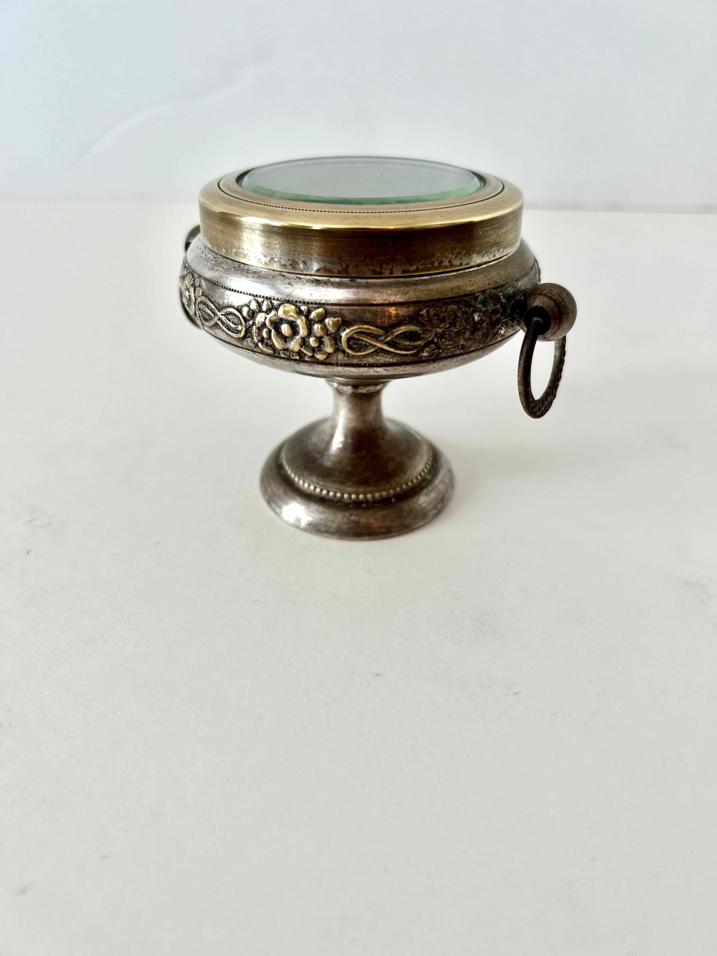 A very nice small pedestaled box with glass lid.  Also termed a casket - the piece is a compliment in many settings - a great way to save herbs, and display them, especially 420!

A nice addition to any desk or work station, night stand piece to