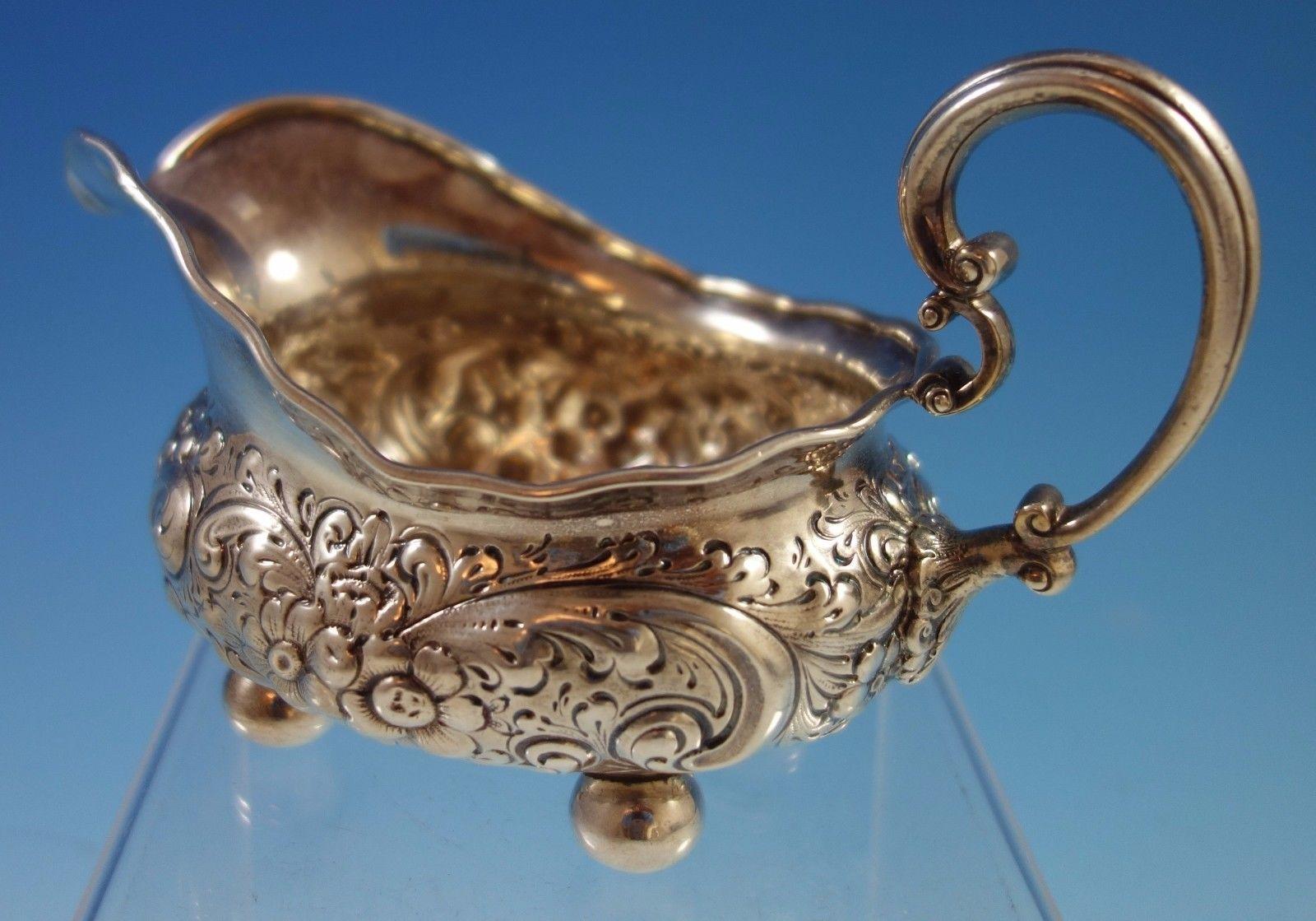Lovely sterling silver gravy boat marked #502 beautifully repoussed with flowers and scrollwork. Likely made by Dominick & Haff (unmarked). This piece weighs 8.55 troy ounces and measures 4