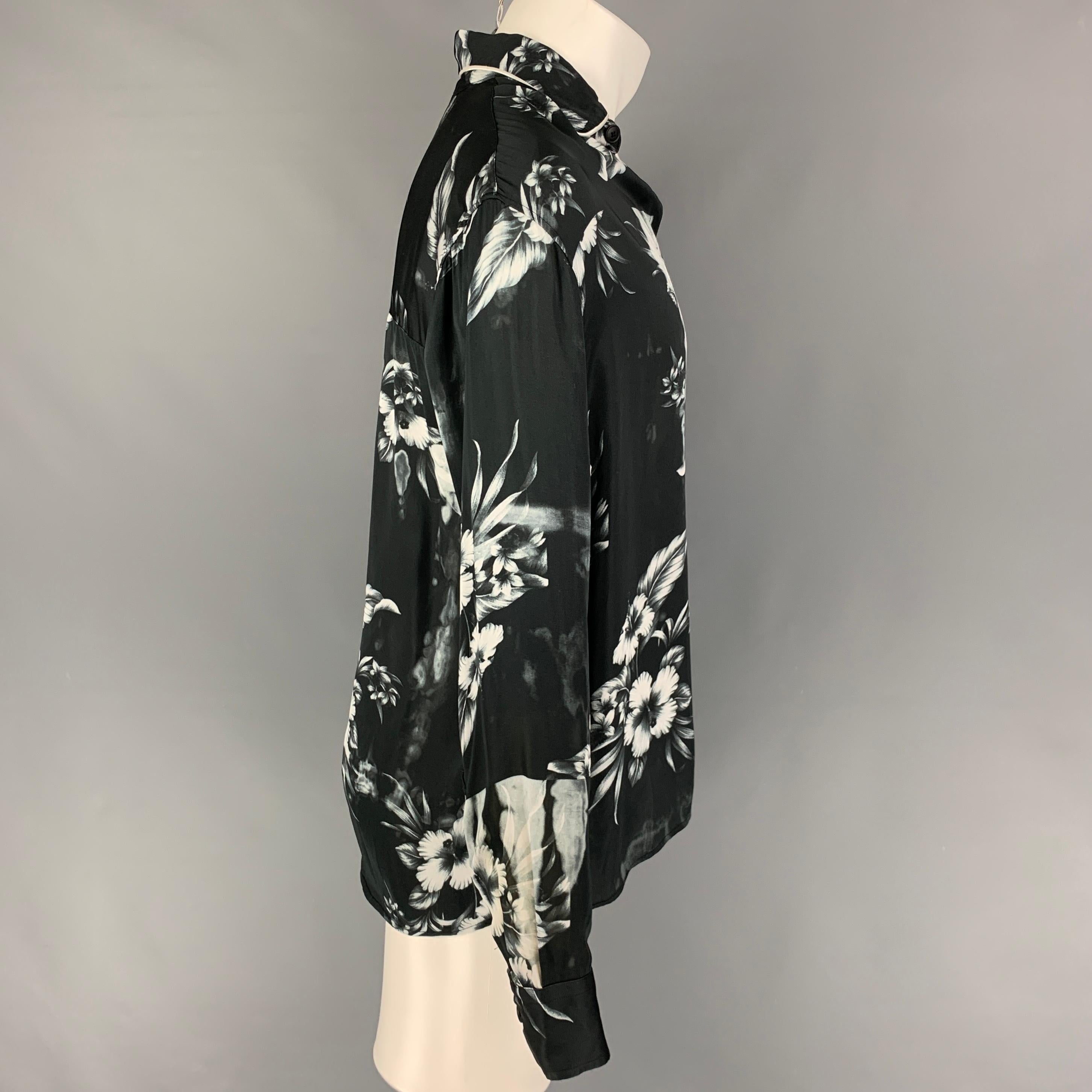 REPRESENT long sleeve shirt comes in a black & white floral viscose featuring a loose fit, spread collar and a button up closure. 

Very Good Pre-Owned Condition.
Marked: S

Measurements:

Shoulder: 19 in.
Chest: 48 in.
Sleeve: 25 in.
Length: 29 in. 