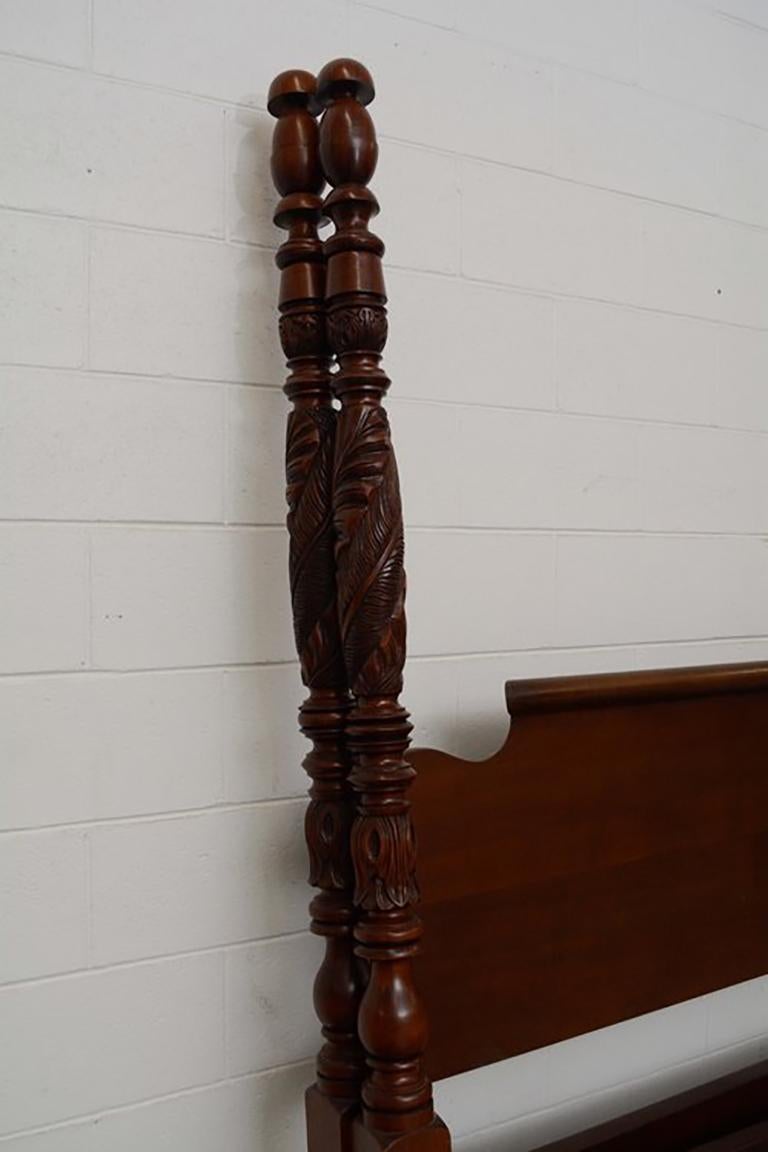 Reproduction Acanthus carved tall post bed, king sized. Hand carved Spanish Cedar posts. Bend back style head board, brass plate bolt covers. Mahogany finish. Measures: 88