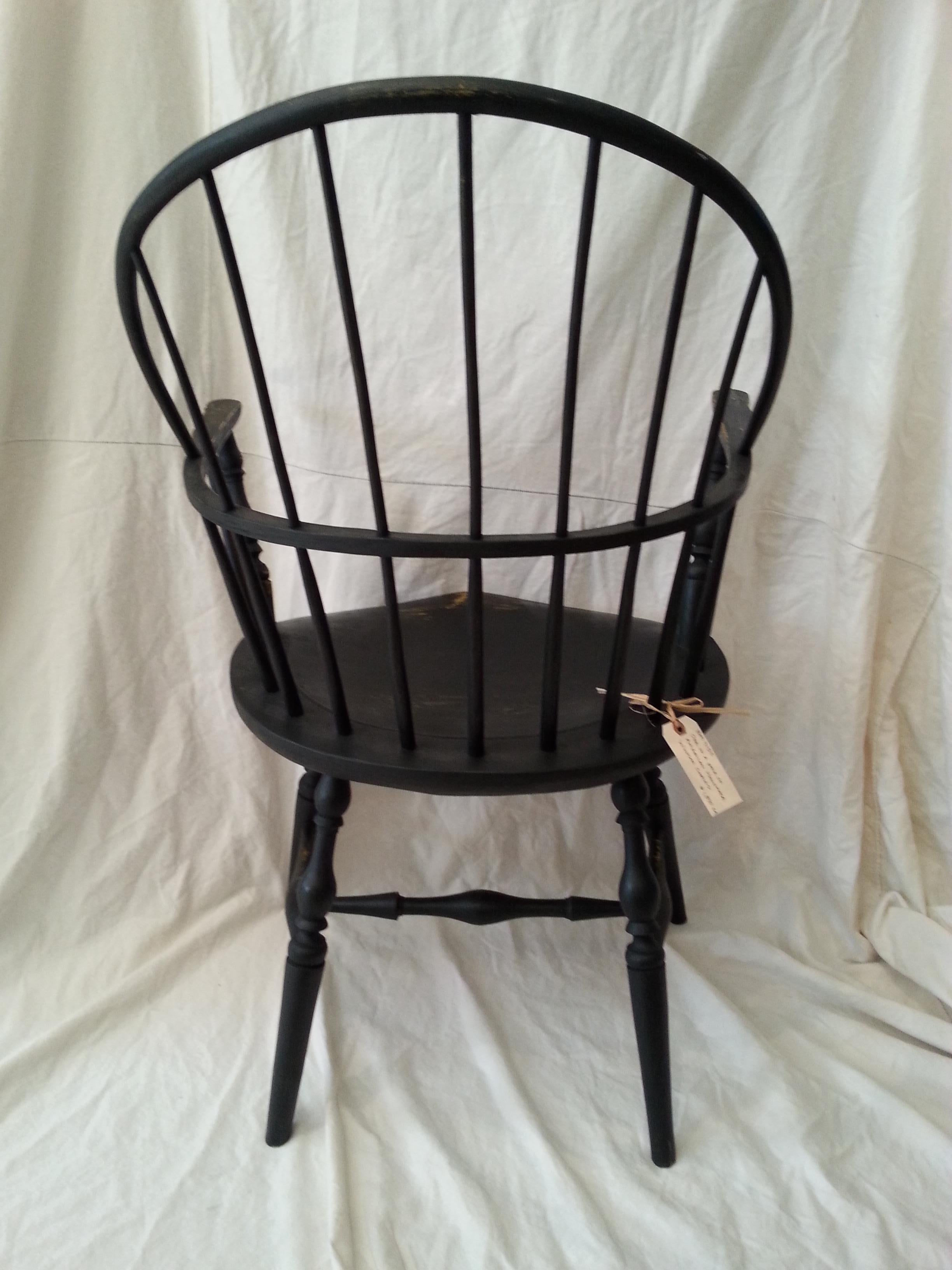 Reproduction black windsor chair.
