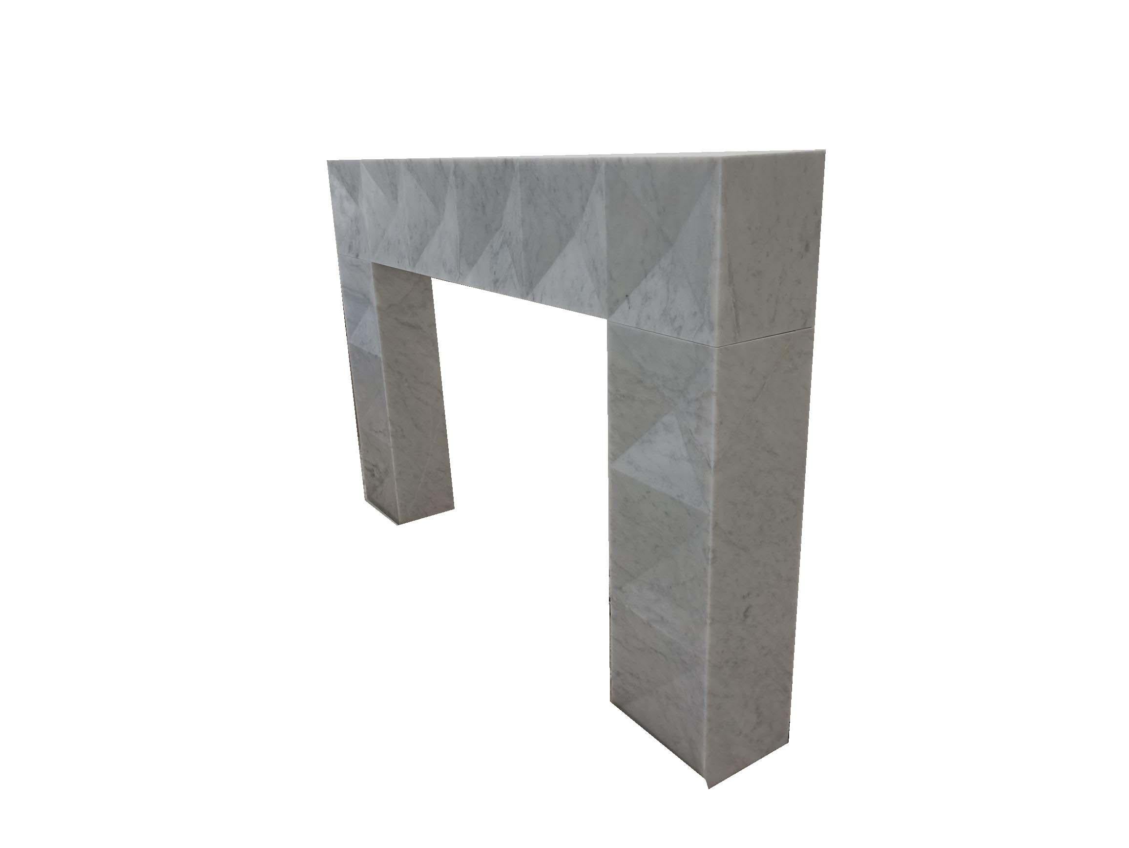 Reproduction Brutalist mantel in honed Carrara marble.

Overall- 59 7/8