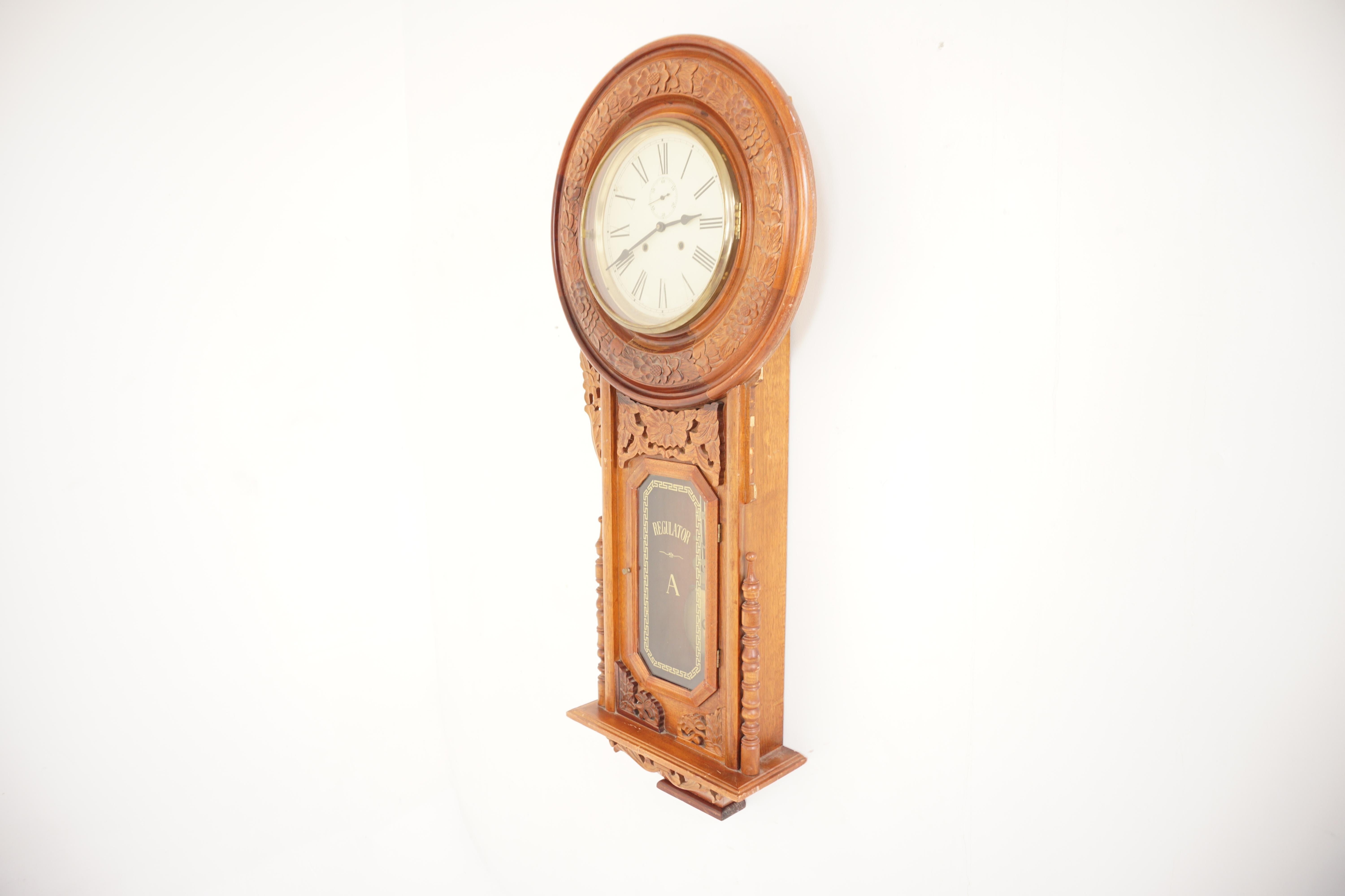 Reproduction carved walnut regulator wall clock, 1960, H107

1960
Circular painted dial with brass pendulum comes with key sold as is

Measures: 23” W × 5.5” D × 52” H.