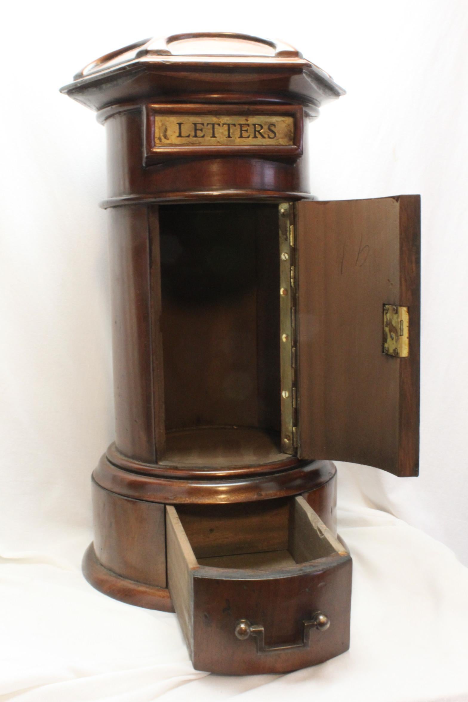 This good quality mahogany country house letter box is a 20th century reproduction of one that would have stood in a central area in a country house or a club or up market guest house where family or guests could deposit mail to be taken to a post