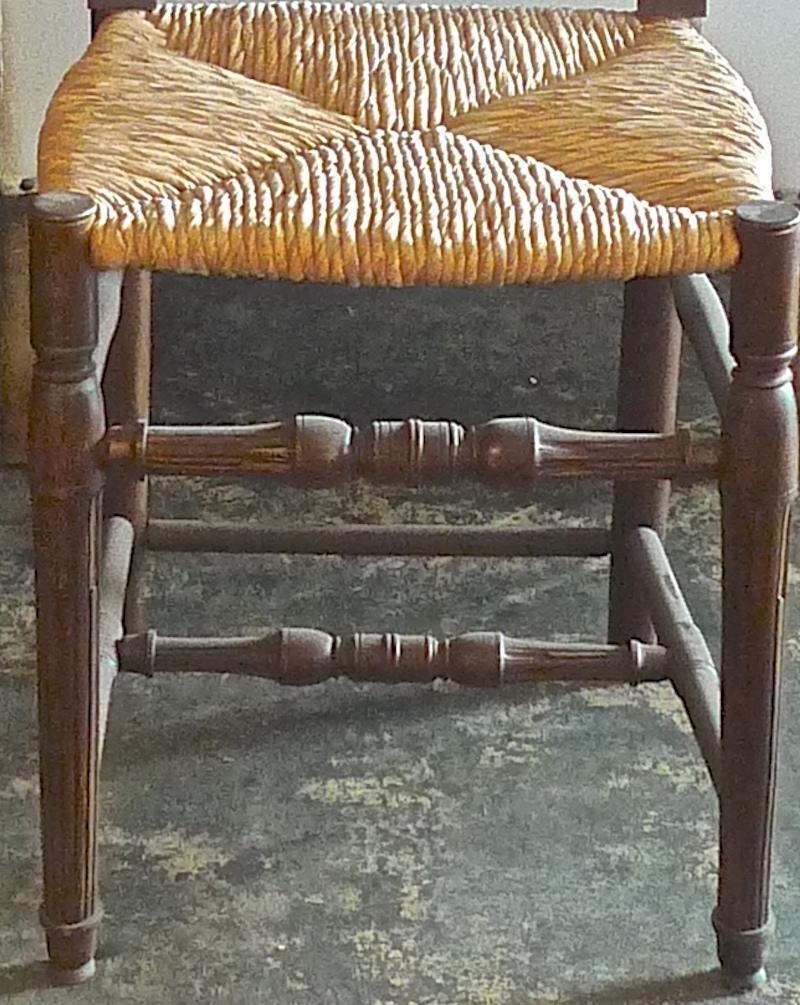 Reproduction French Louis XVI style bar stool with rush seat and no back.