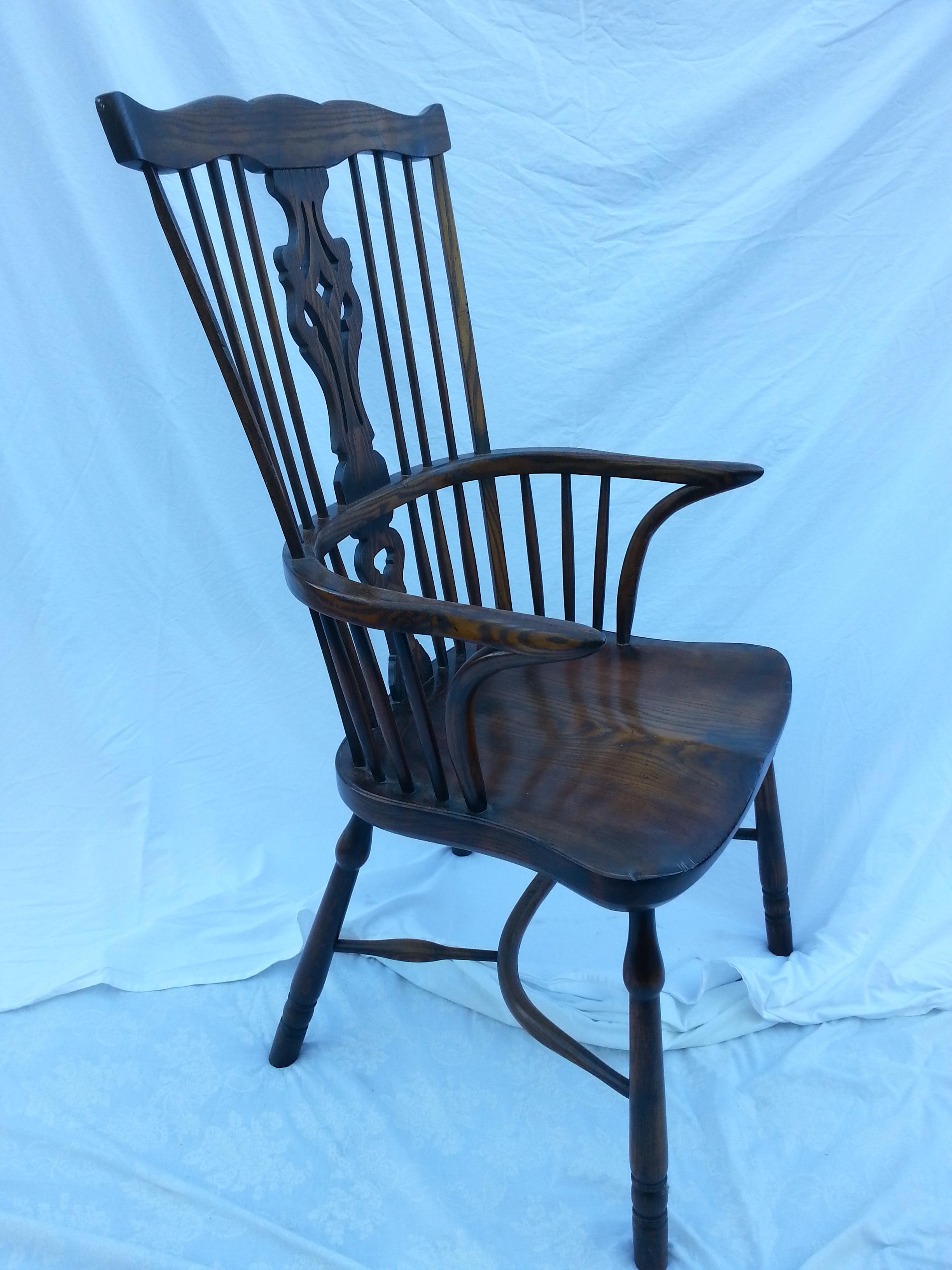 Reproduction Georgian Windsor Spatback armchair with dark stain.