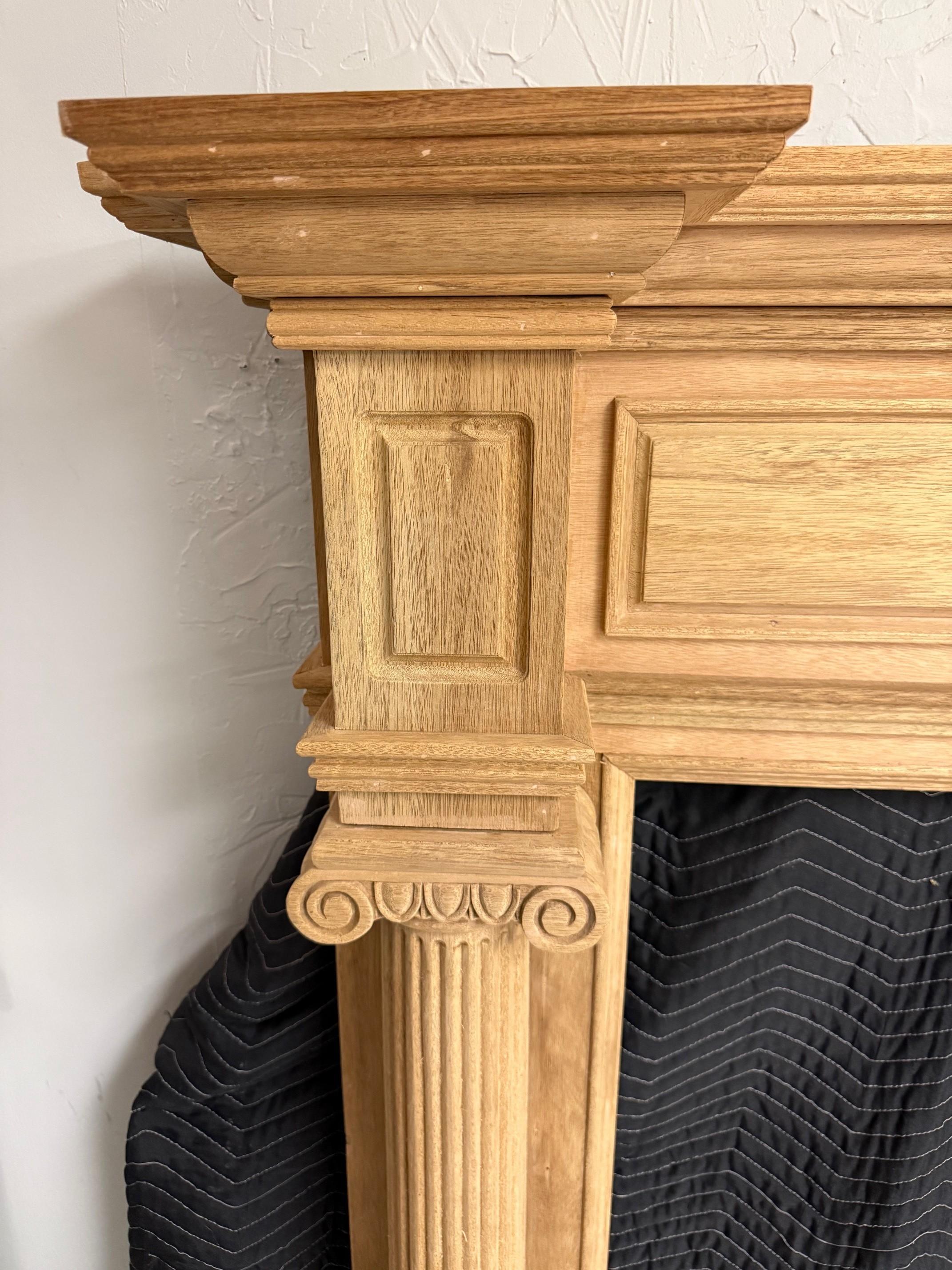 Cinese Reproduction Mahogany Fireplace Mantel with Fluted Columns and Carved Capitals in vendita