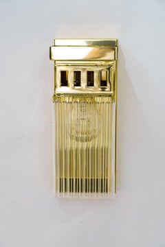 Reproduction of a art deco wall lamp with glass sticks