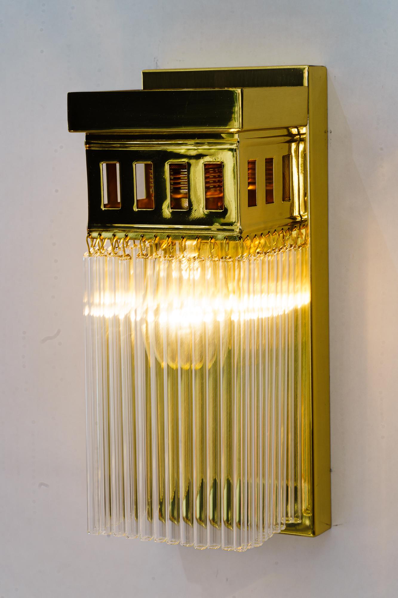 Brass Reproduction of a art deco wall lamp with glass sticks For Sale