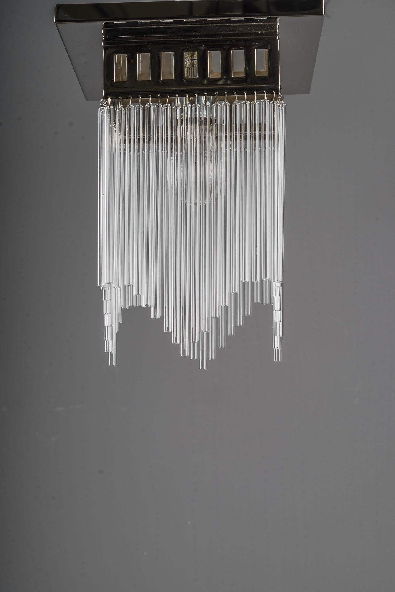 Ceiling lamp in the style of Art deco
This is a reproduction. ( New )
We have also the same in brass would be a little bit cheaper.
Glass rods can be as shown or they can be straight.
Depending on the order quantity it can take up to 2 weeks to