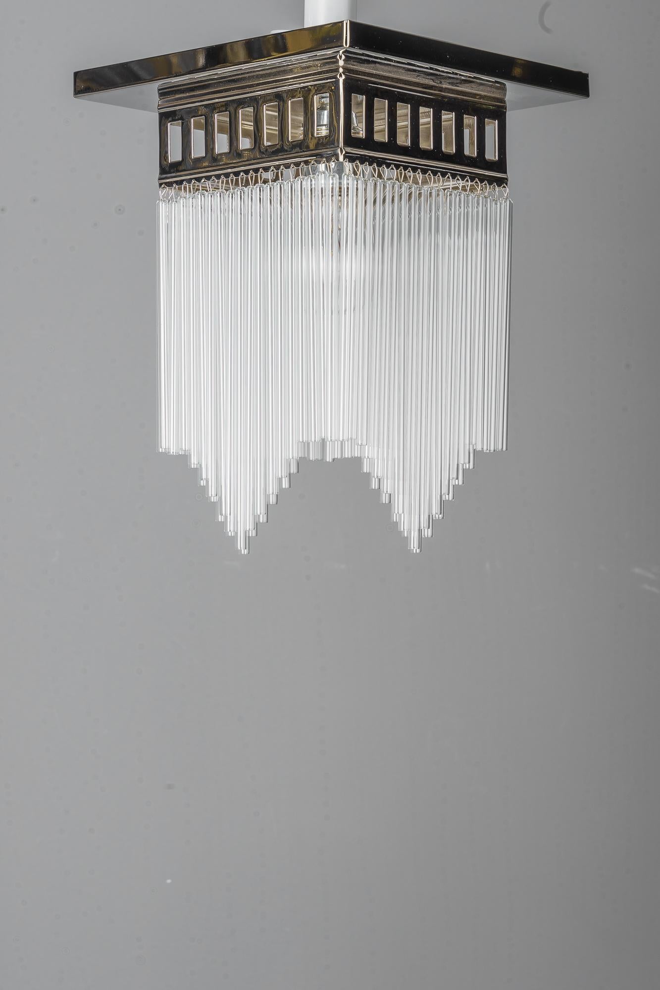 Art Deco Reproduction of a nickeel - plated art deco ceiling lamp with glass sticks  For Sale