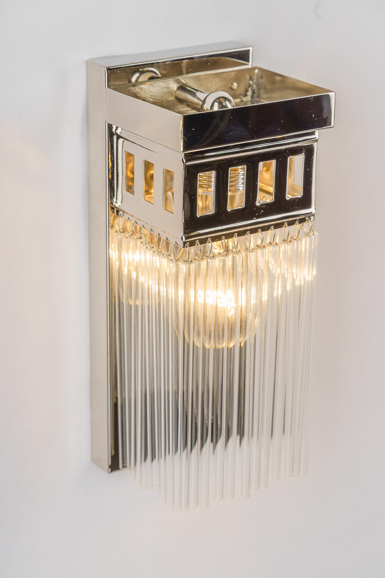 Reproduction of a nickel - plated art deco wall lamp with glass sticks For Sale 2