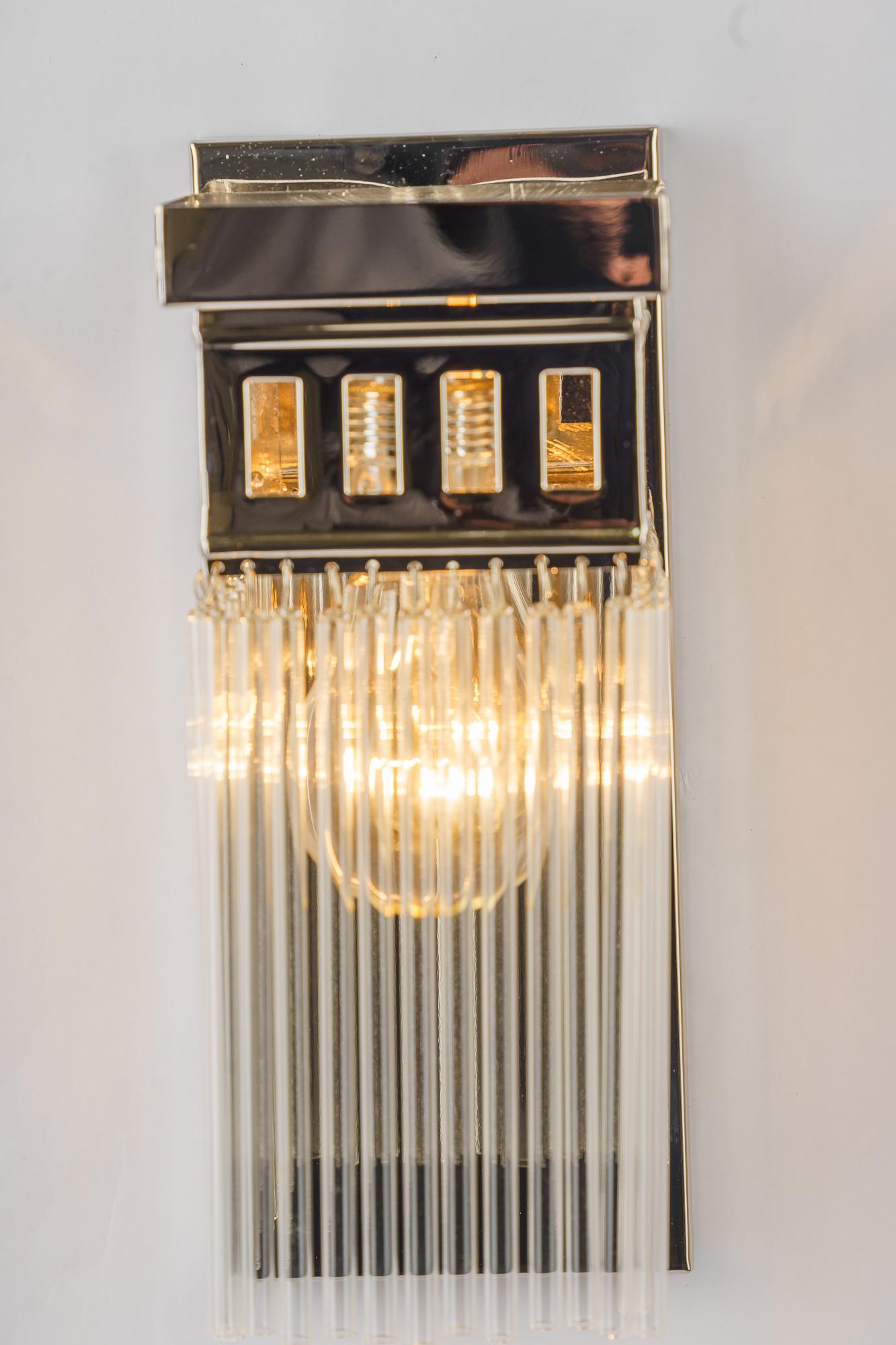 Austrian Reproduction of a nickel - plated art deco wall lamp with glass sticks For Sale