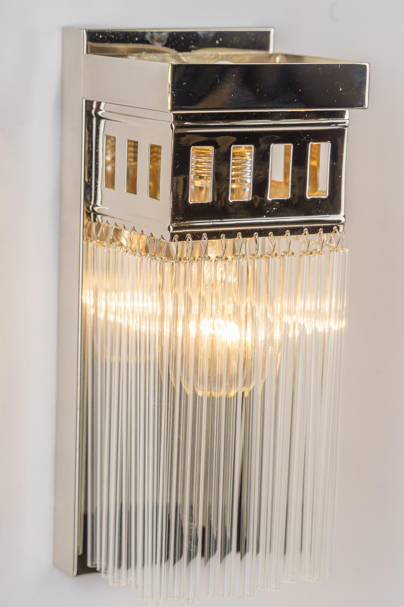 Reproduction of a nickel - plated art deco wall lamp with glass sticks In New Condition For Sale In Wien, AT