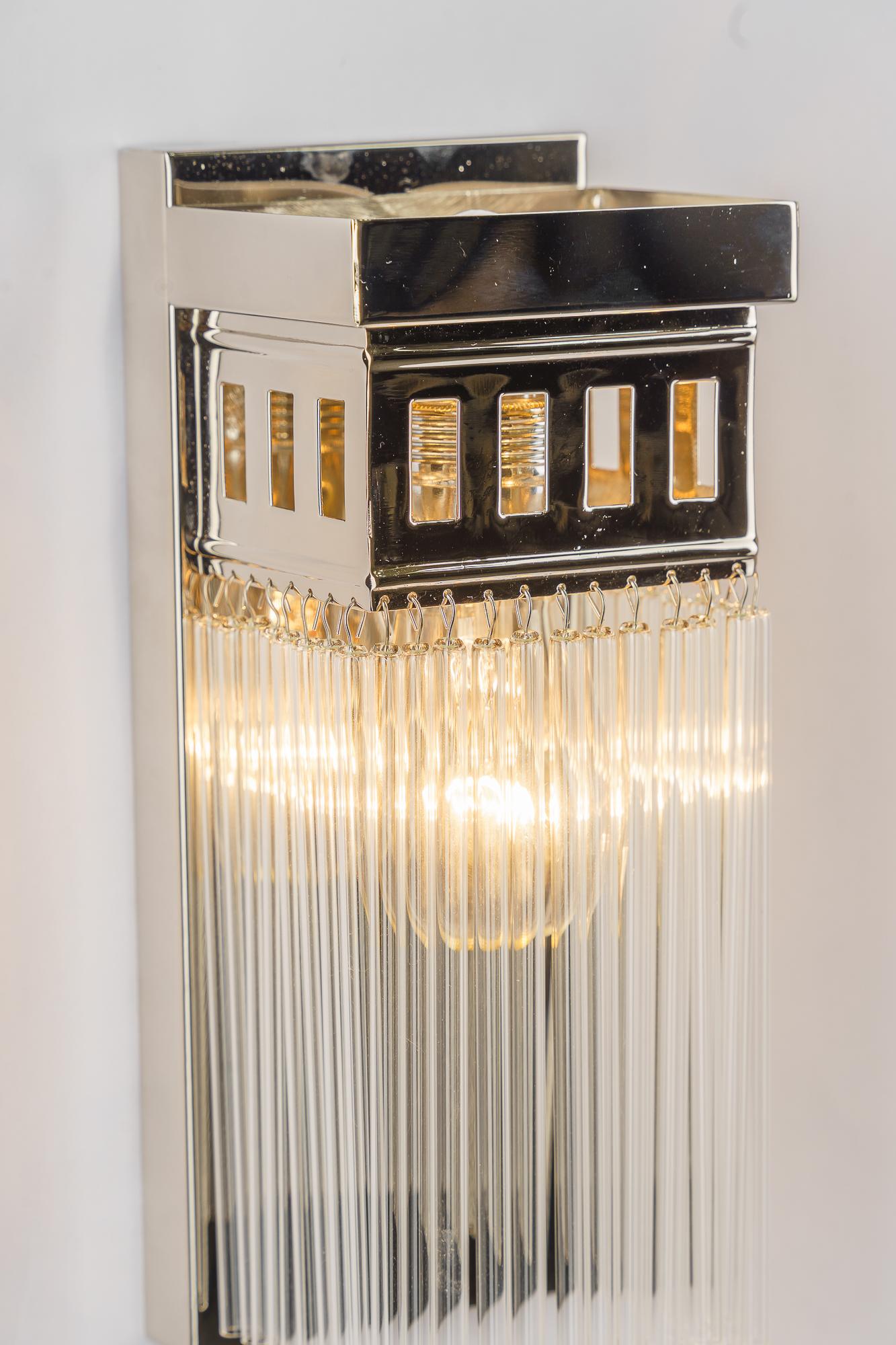 Contemporary Reproduction of a nickel - plated art deco wall lamp with glass sticks For Sale