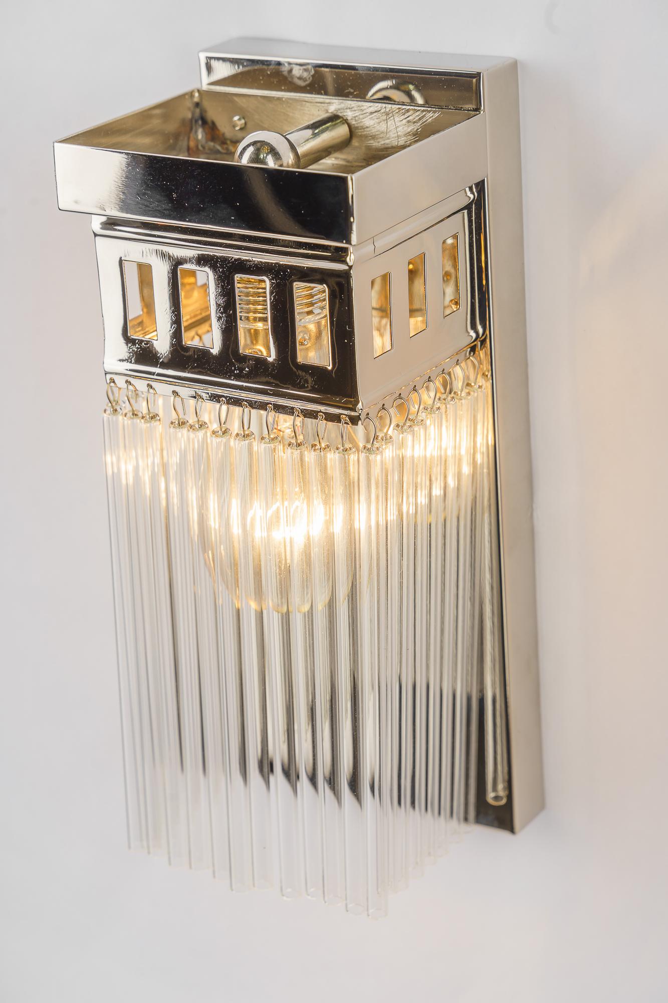 Reproduction of a nickel - plated art deco wall lamp with glass sticks For Sale 1
