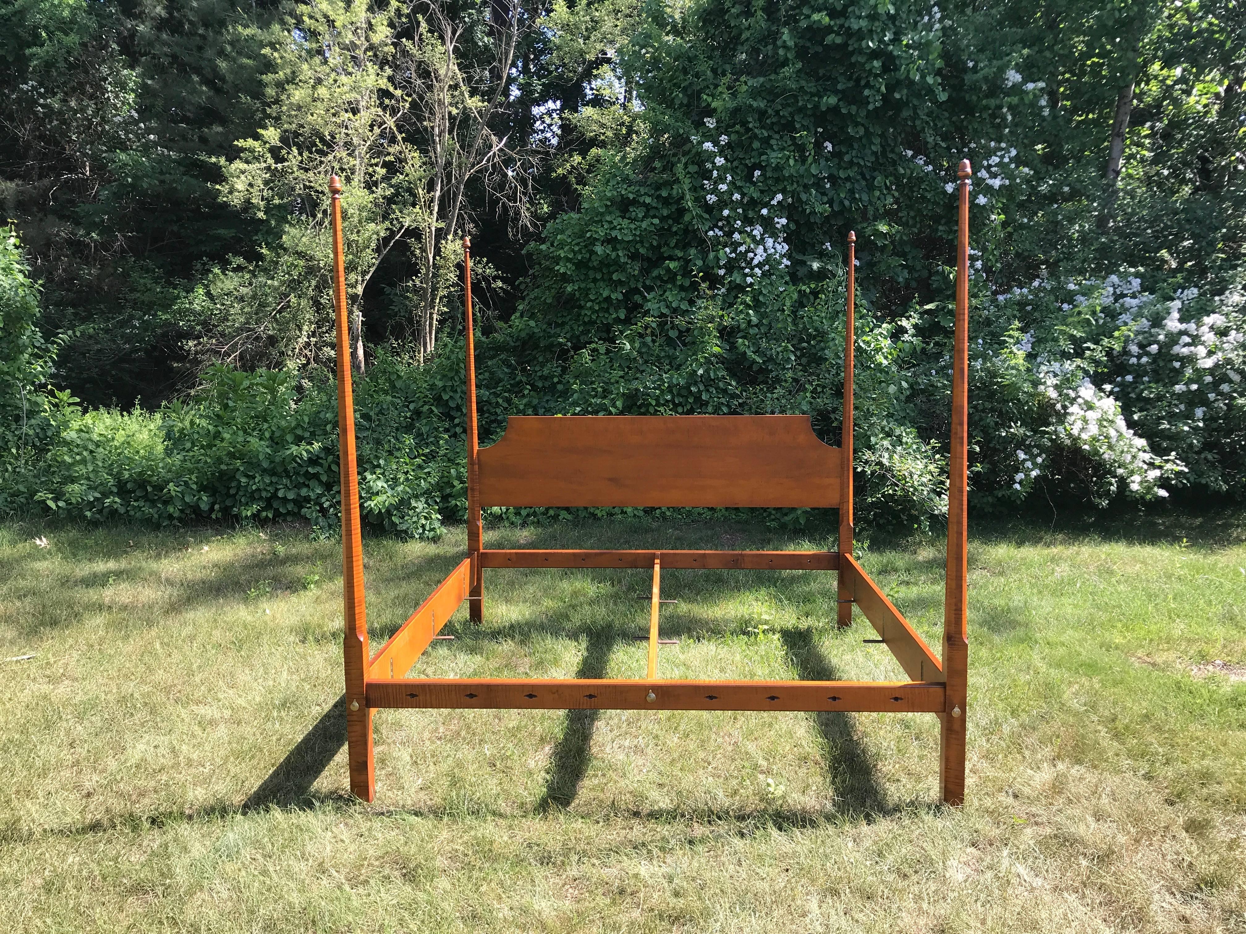 Reproduction pencil post king bed in tiger maple with acorn finials.
Measures: 82