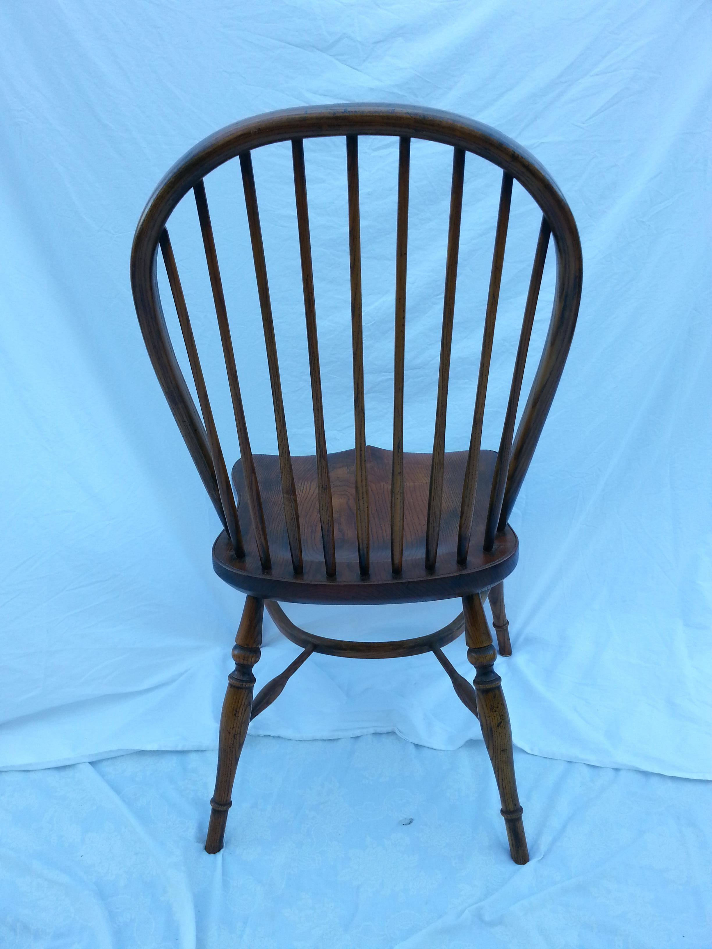 Reproduction spindle back oak stained side chair.
