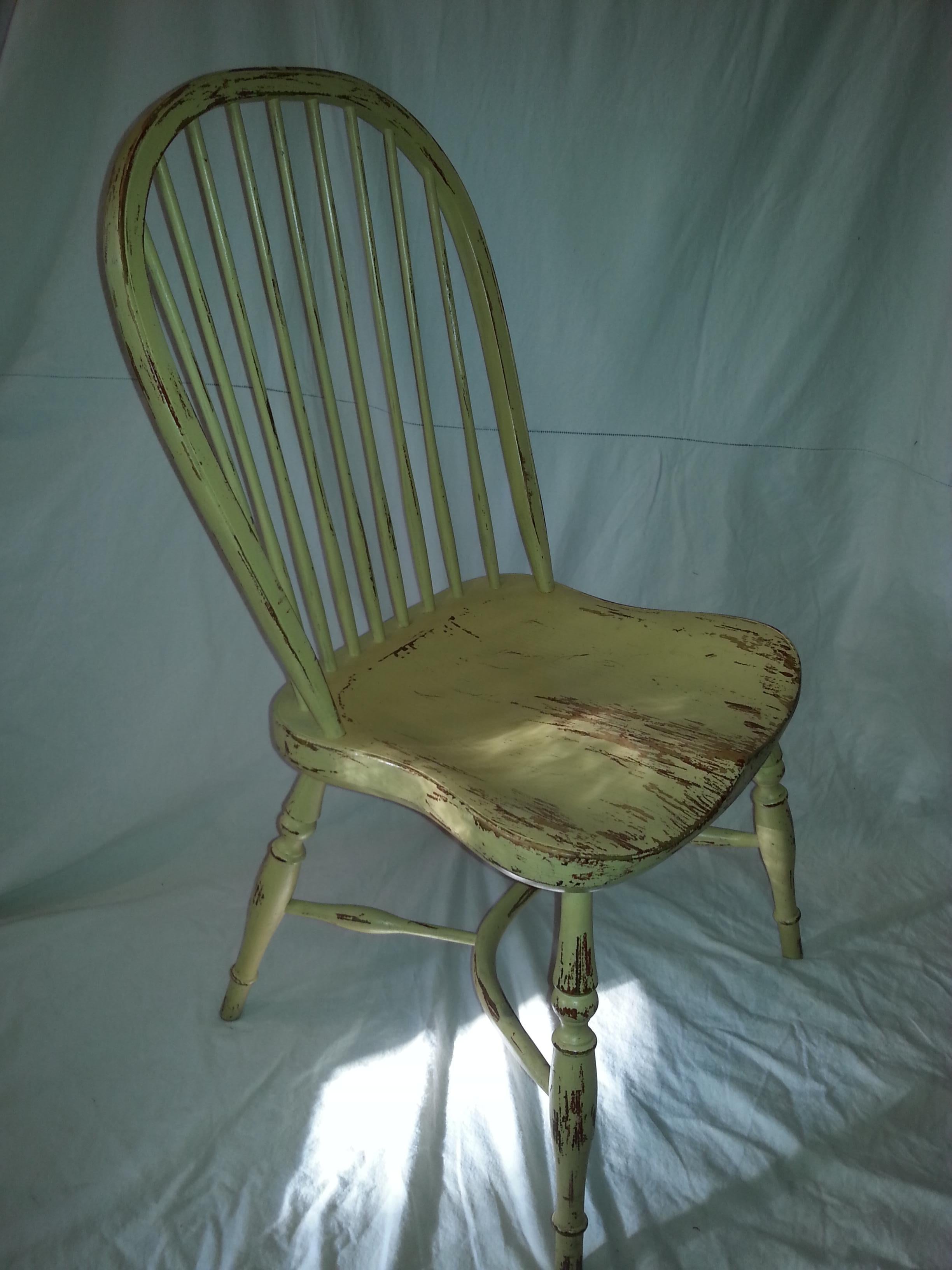 Reproduction spindle back yellow side chair.
