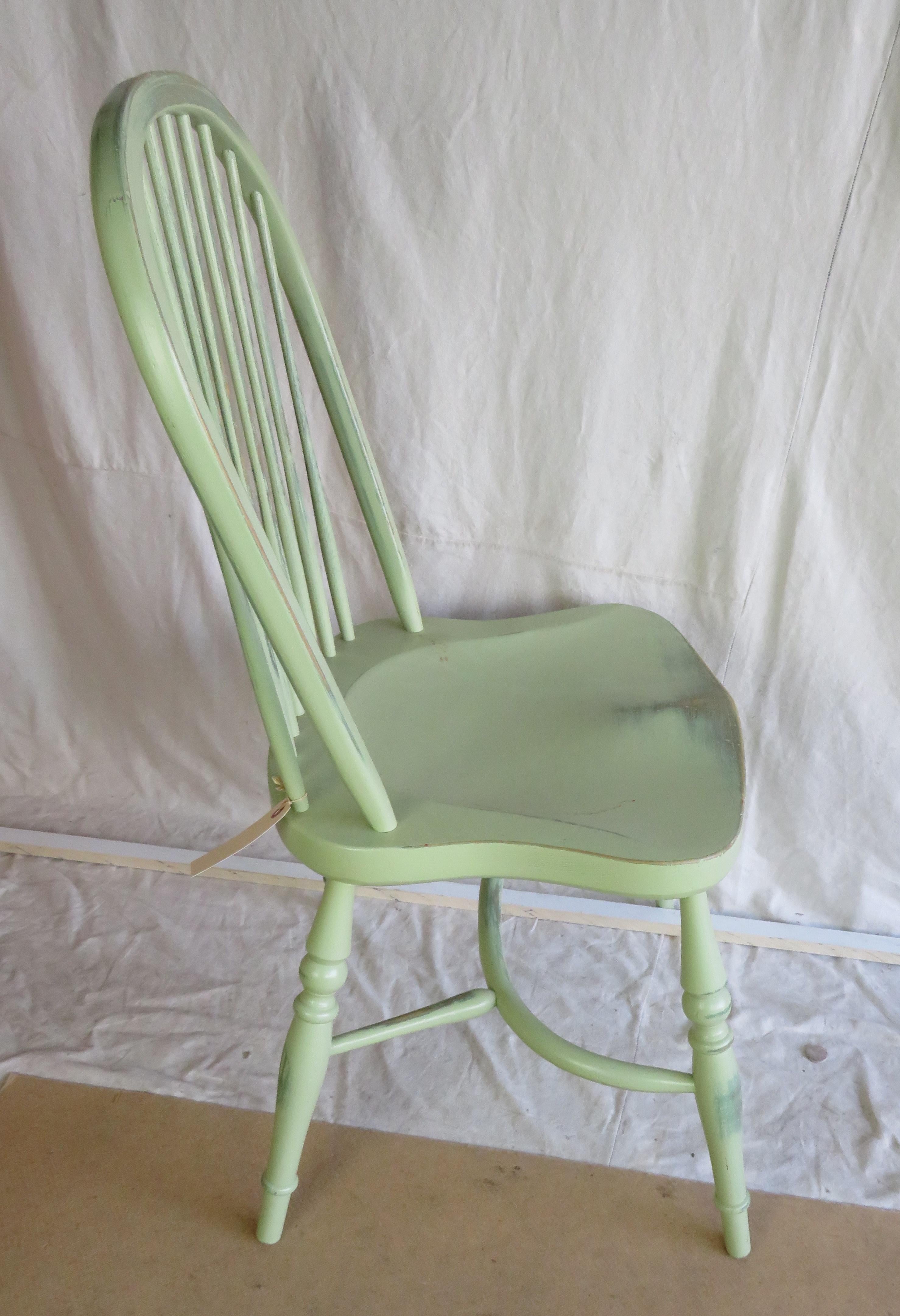 Reproduction stick back windsor side chair in light green distressed finish.