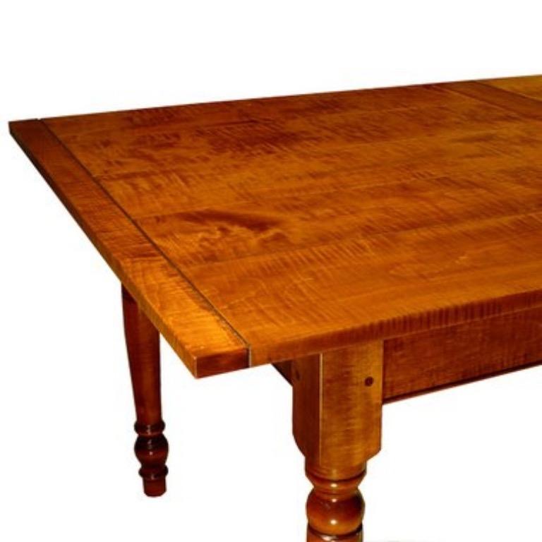 Reproduction farm table in tiger maple. Measures: 7' L x 42
