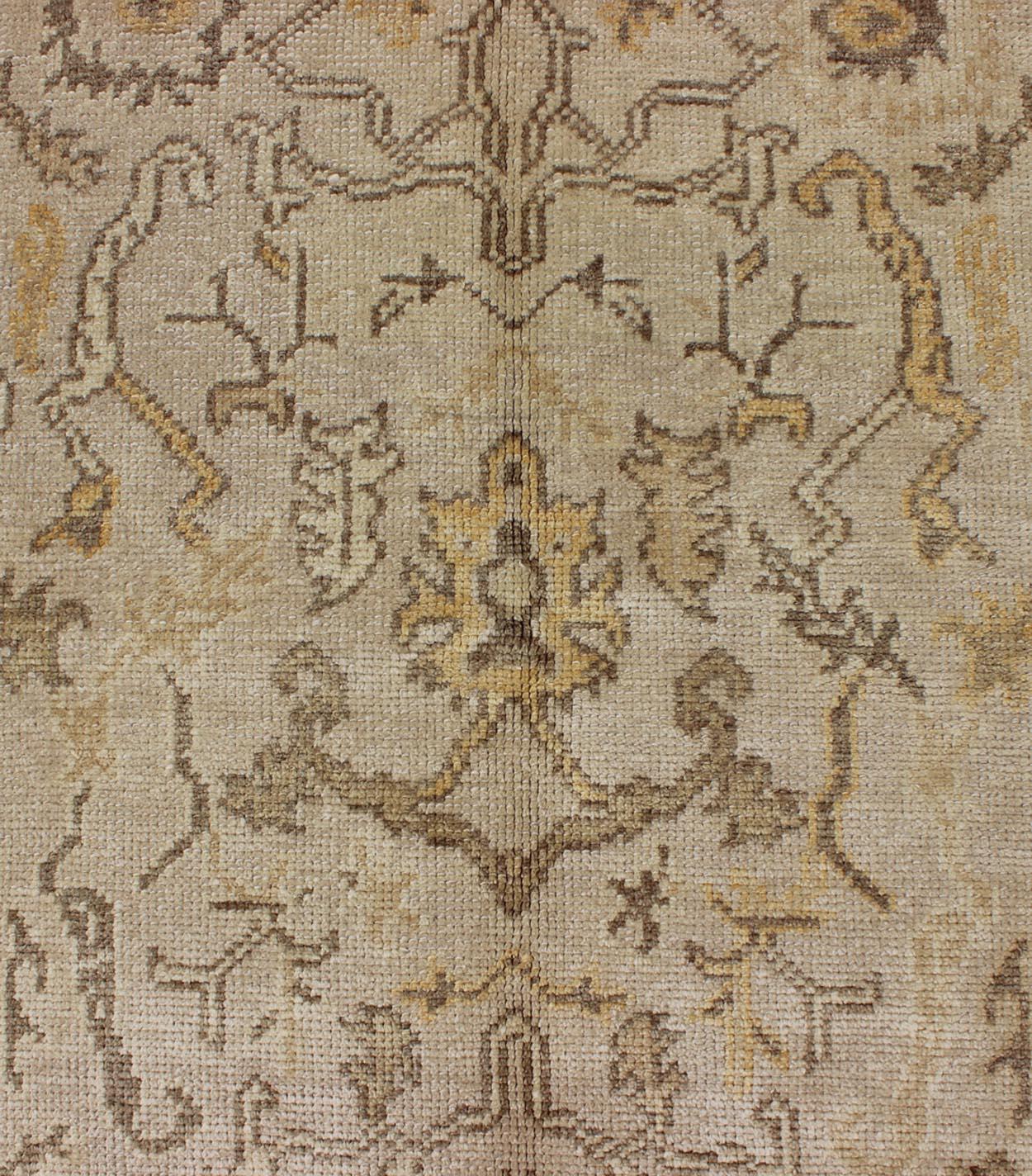 Contemporary Reproduction Turkish Oushak Rug with Stylized Floral Design in Earth Tone Colors For Sale